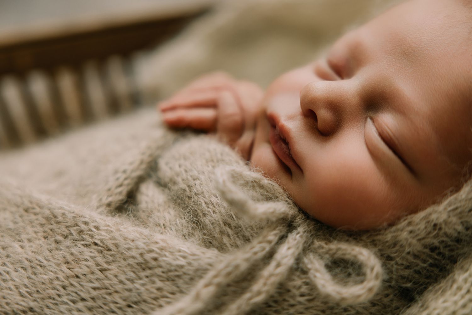 Fallbrook CA newborn photography studio offering posed baby portraits with wraps and props by Sarah Bracci Photographics.