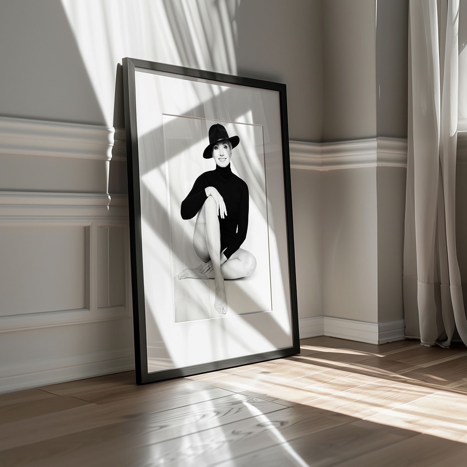 Minimalist interior photos showing framed artwork and window shadows on white walls.
