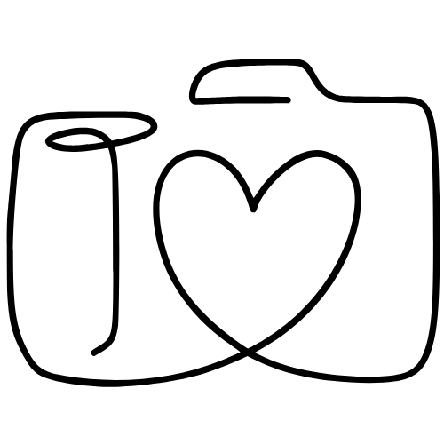 Line art illustration of a camera with a heart shape drawn in the lens, symbolizing a love of photography.