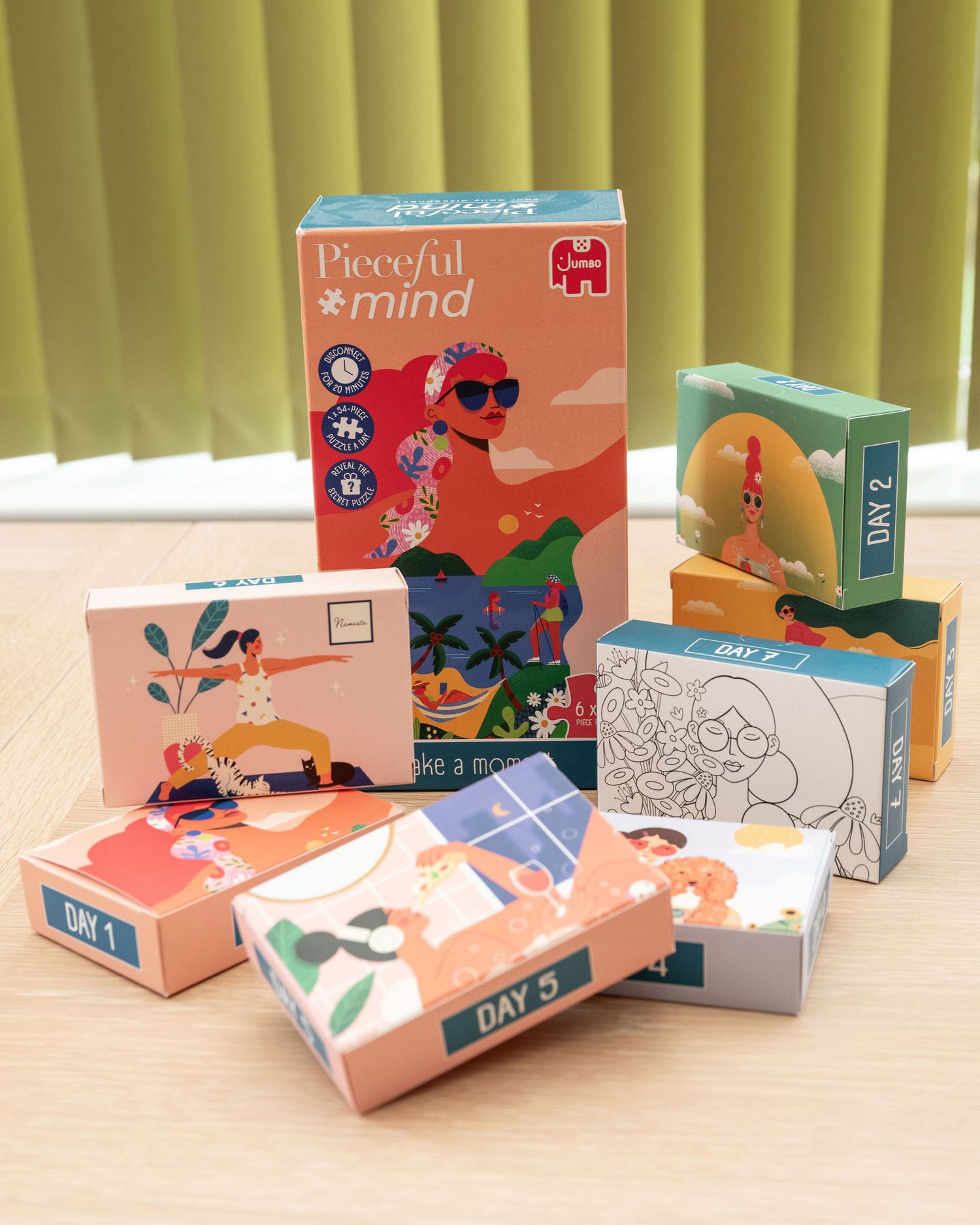 A collection of colorful board game boxes titled 'Peaceful Mind' with various designs and illustrations displayed on a table.
