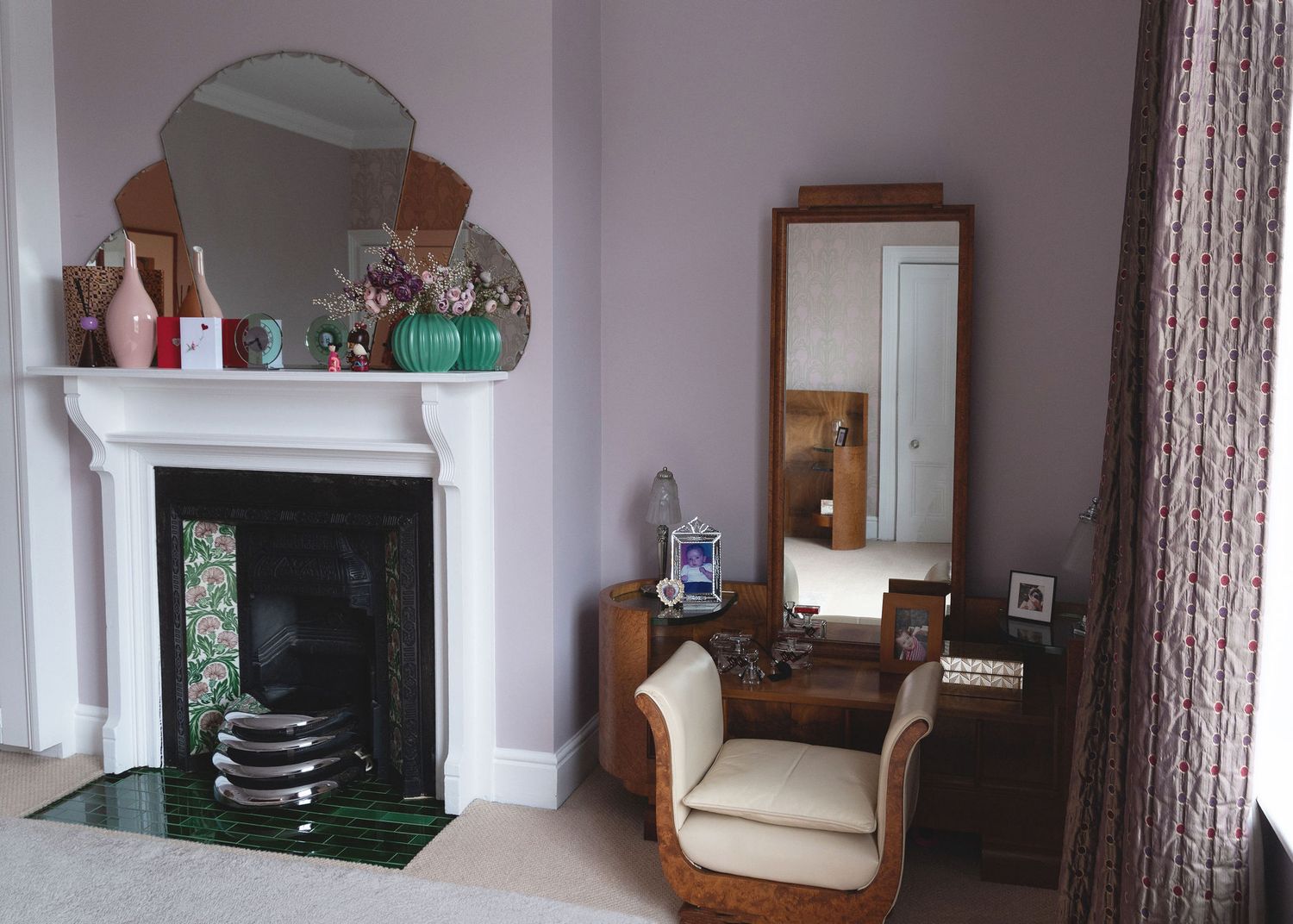 A panoramic view of a modern living room interior with white walls, furniture, and decorative elements.
