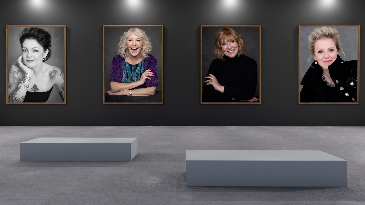 Gallery wall display featuring four dramatic portrait photographs with exhibition platforms.