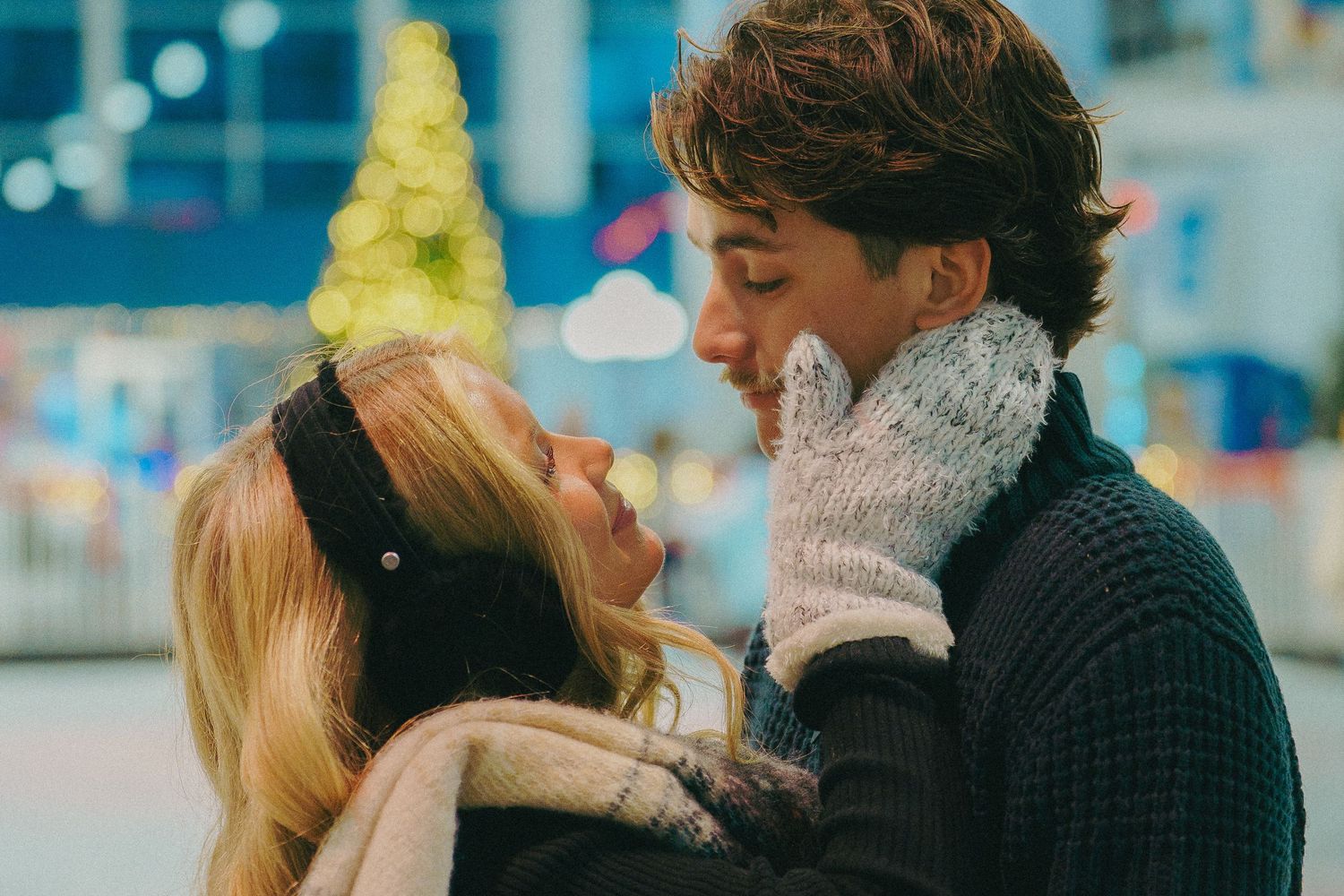 Couple looking at each other while ice skating at the Carousel Hotel in Ocean City, Maryland