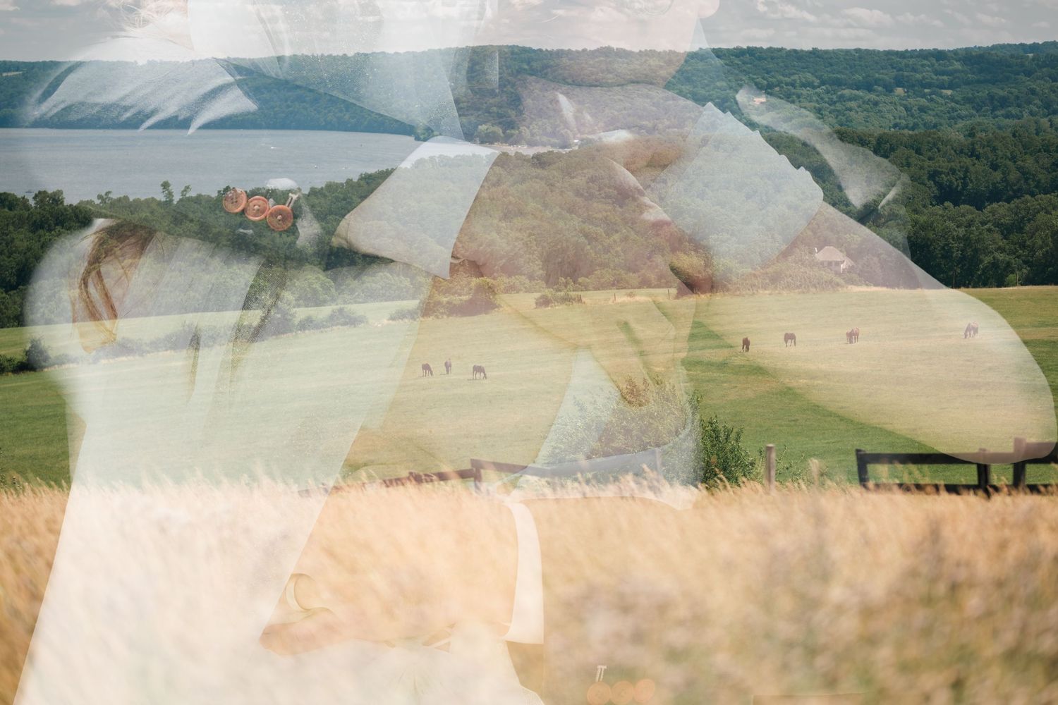 Double exposure photo of a couple kissing overlaid with a scenic countryside landscape and golden wheat fields.