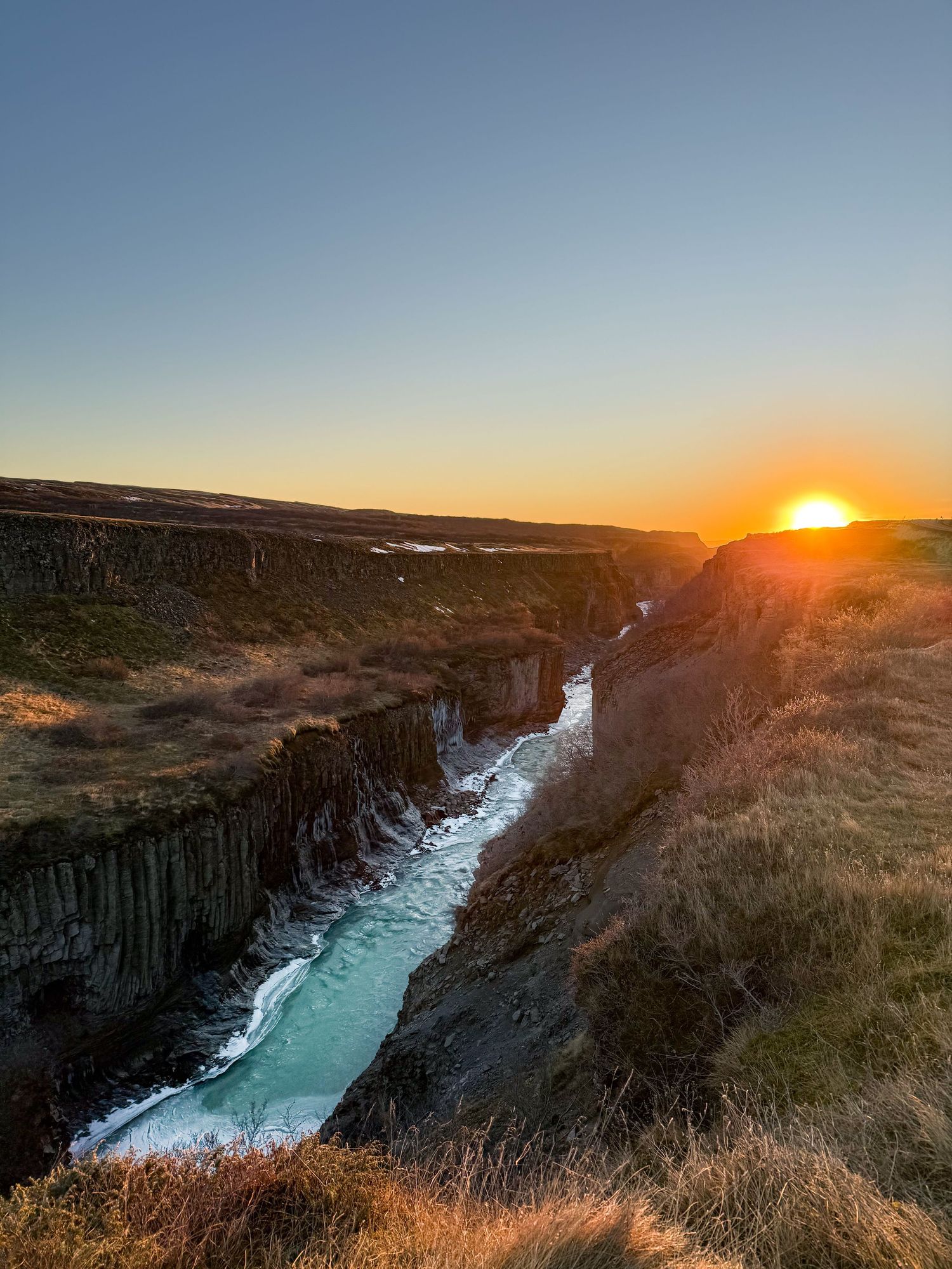 Panoramic sequence of Aldeyjarfoss waterfall in Iceland at sunset with basalt columns and turquoise water flowing below.