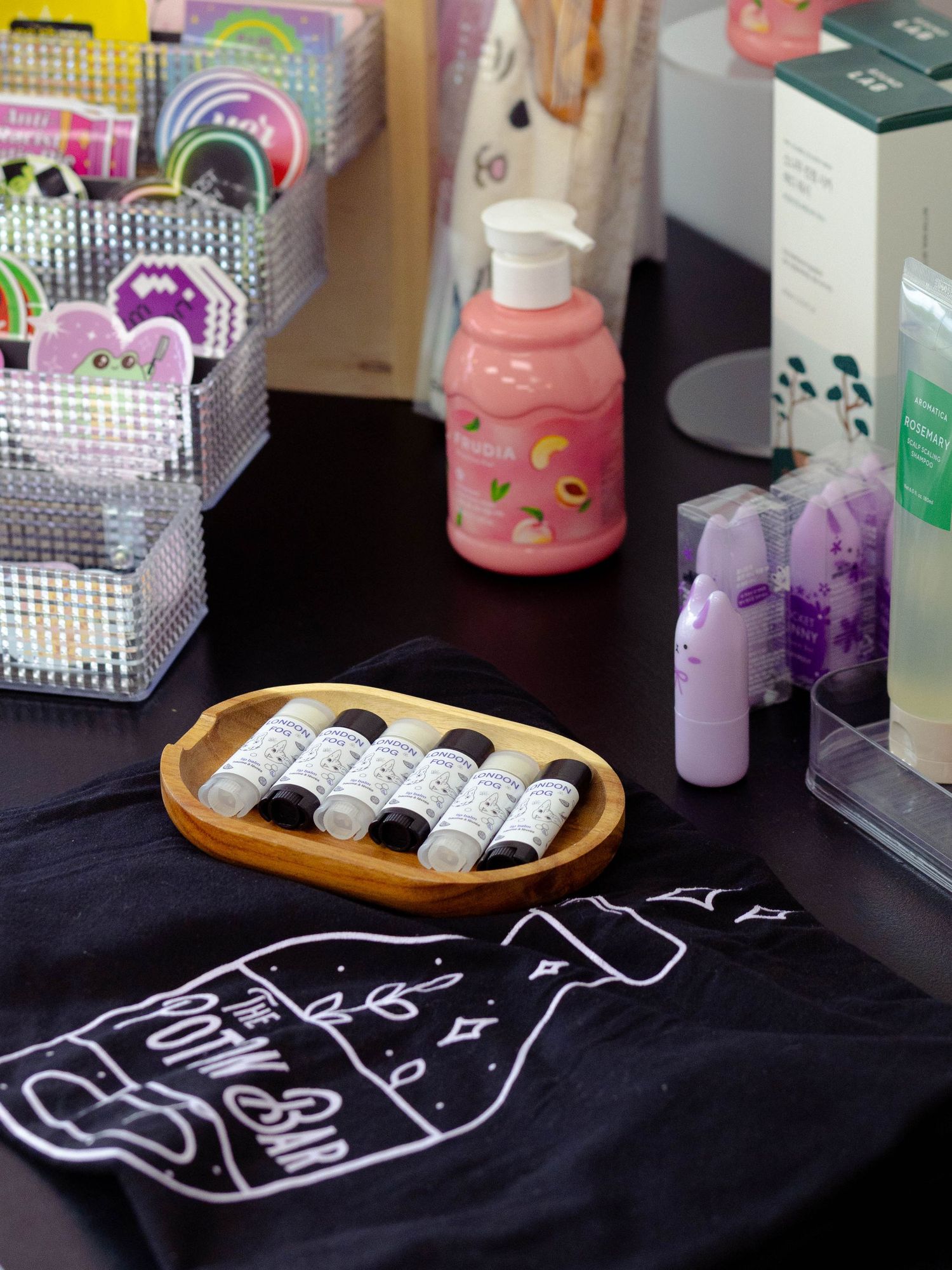 Colourful skincare products and branded merchandise displayed for a small business