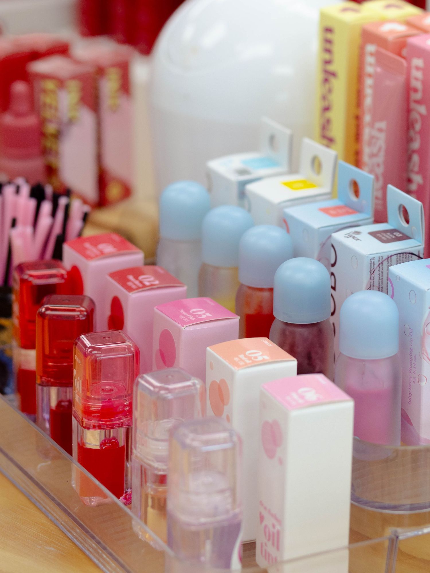 Close-up product shot of various skincare and lip products in a store for branding.