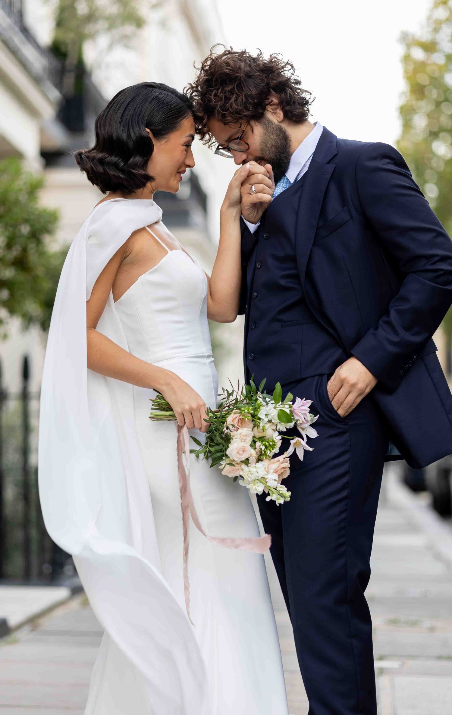 Romantic embrace of a newlywed couple in Belgravia, London, captured by Alba del Sol — refined fine art wedding photography.