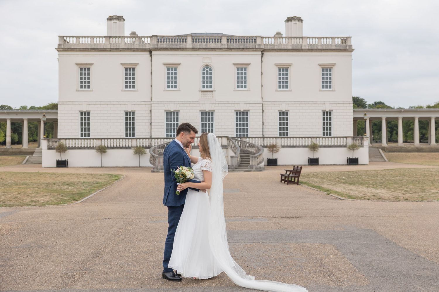 Elegant groom and bride dancing by the Queen House in Greenwich, timeless fine art wedding photography by Alba del Sol.