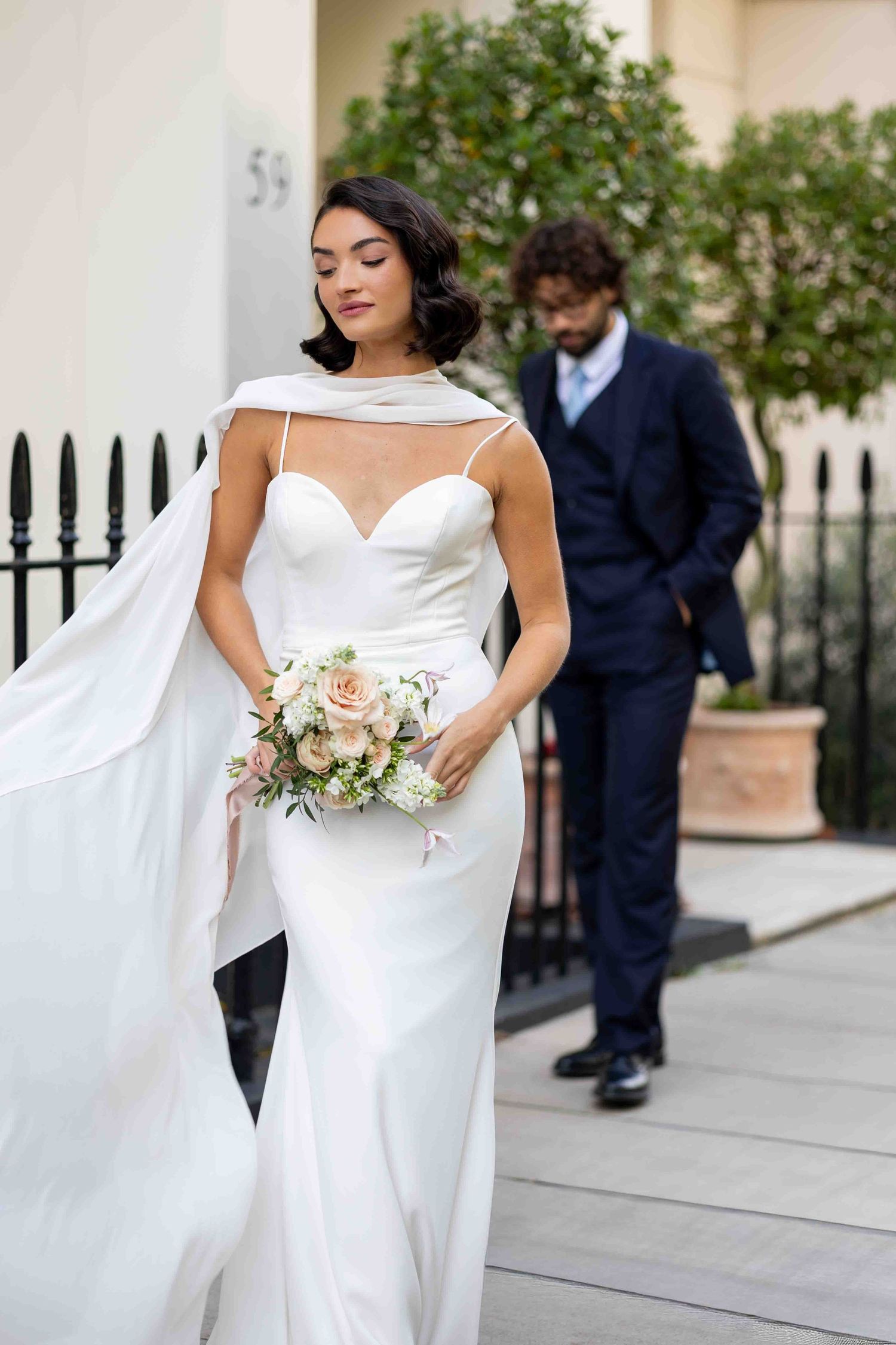 Elegant bride and groom posing with blush bouquet in Belgravia, London — timeless fine art wedding photography by Alba del Sol