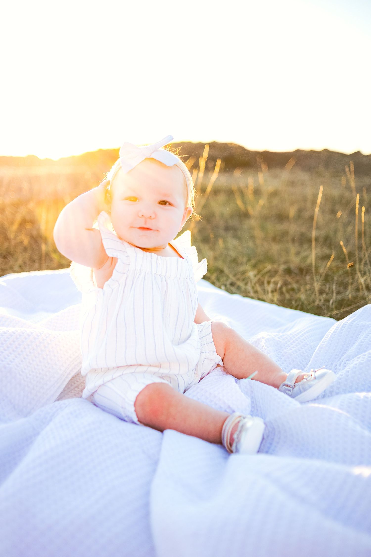 Golden hour family photo. Candid family photo. PNW family photo session overlooking puget sound. Outdoor family photos. Baby in a field