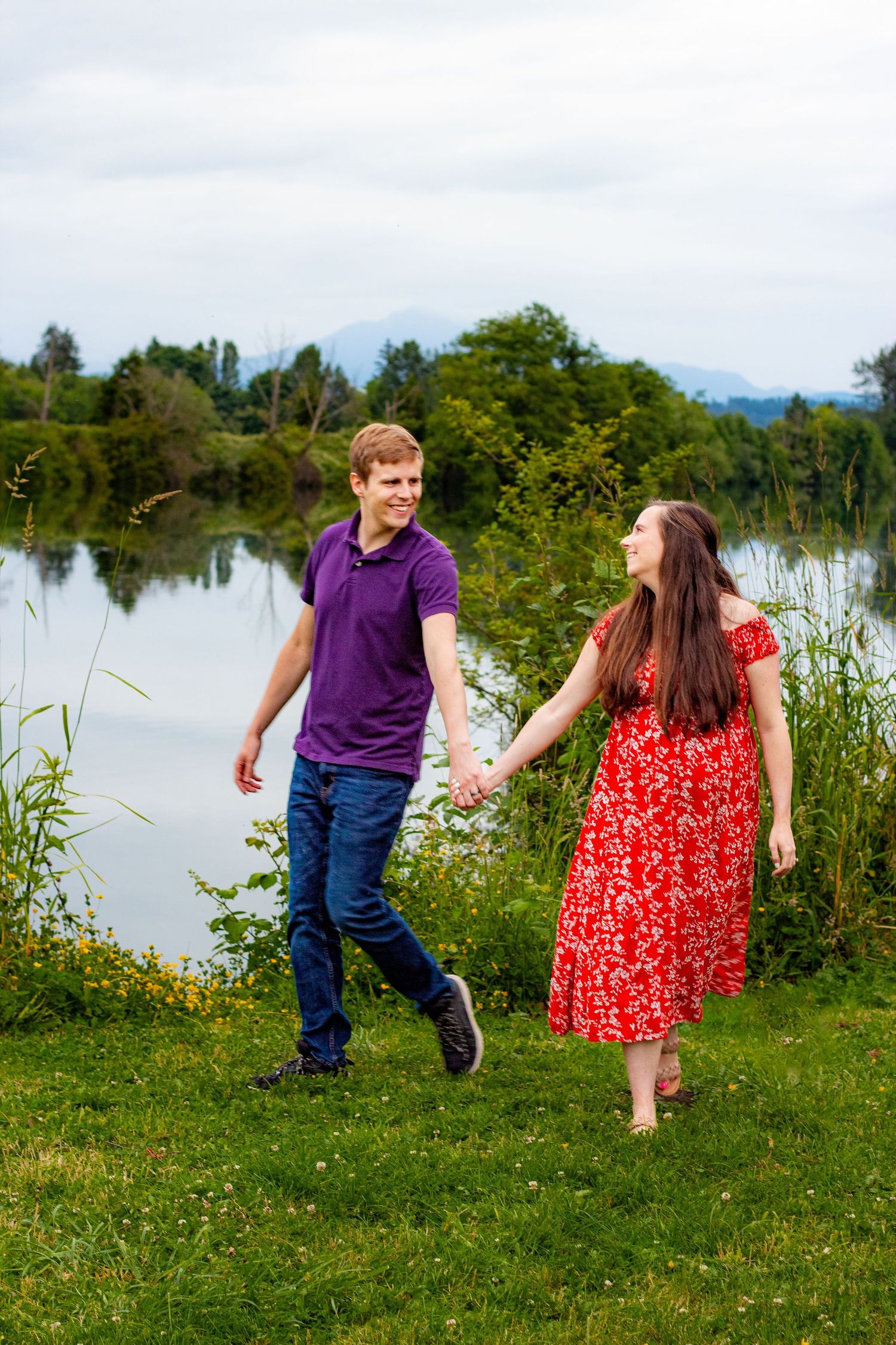 Maternity photos in a park near the river. Candid maternity photo. Moody. Snohomish river in the background