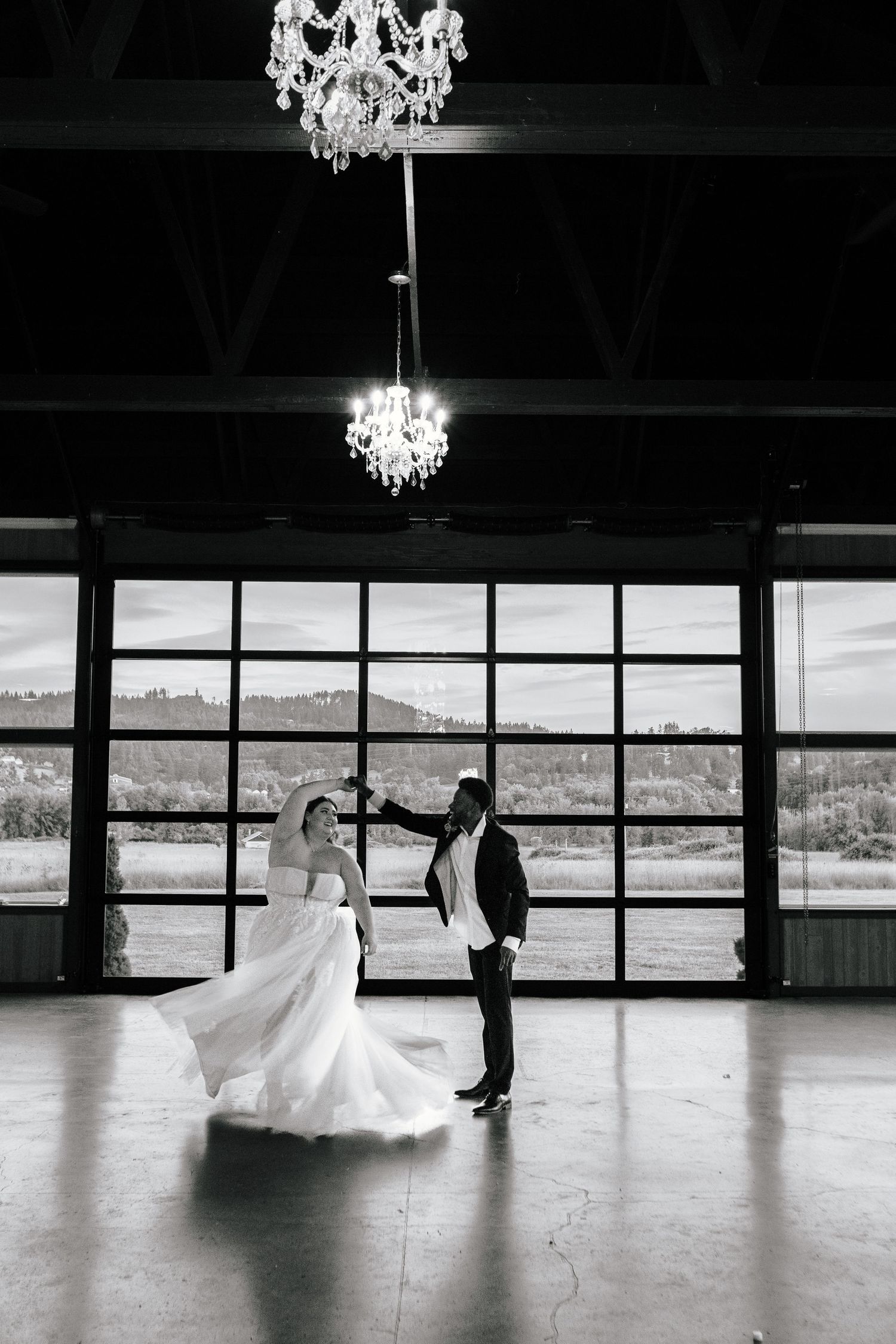 candid wedding photos in central Oregon at the water oasis. Beautiful wedding photos. Photo of the private last dance in the ballroom. Moody