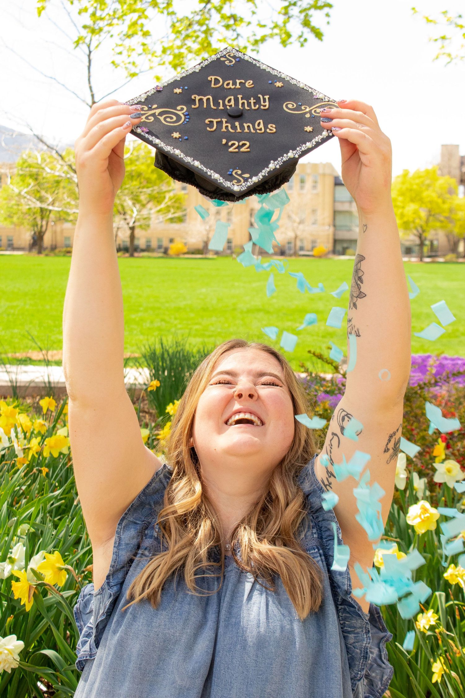 Senior photo on USU campus in Logan, UT. outdoor senior photo. Foliage in the background. Rugged senior photo. Female senior photo