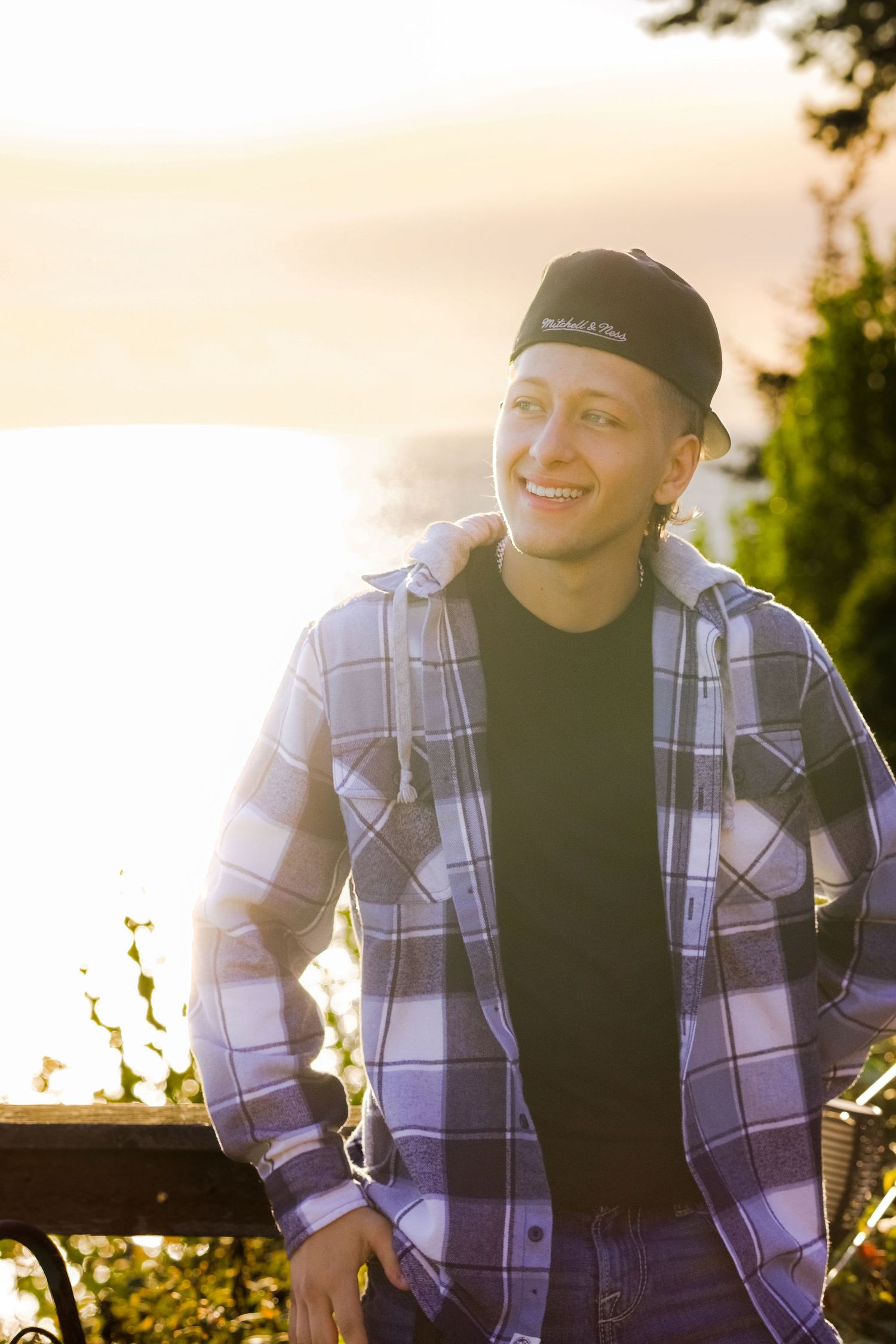Senior photo at golden hour in Tulalip, Wa. outdoor senior photo. Water in the background. Rugged senior photo. Male senior photo