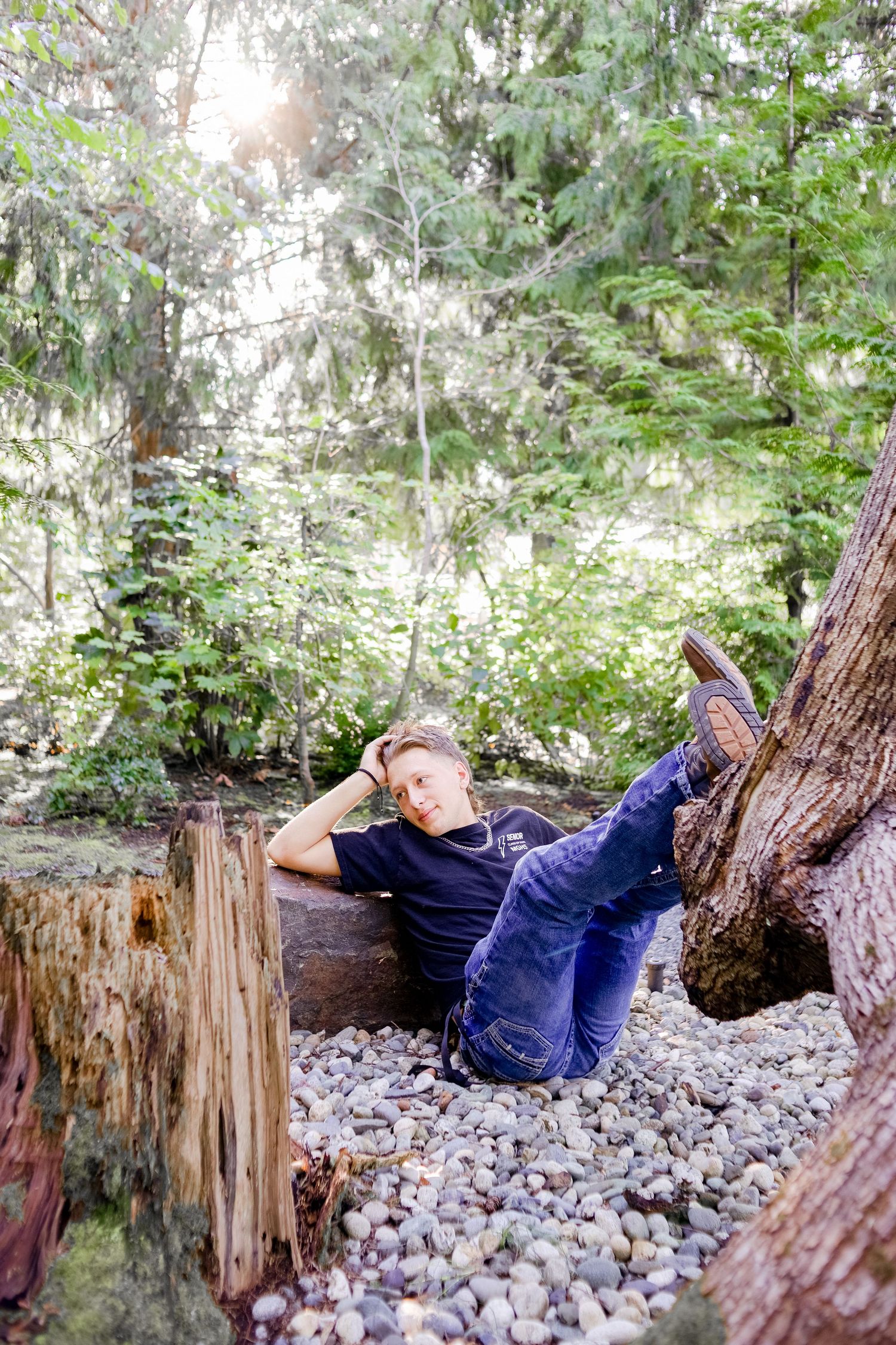 Senior photo at golden hour in Tulalip, Wa. outdoor senior photo. Foliage in the background. Rugged senior photo. Male senior photo