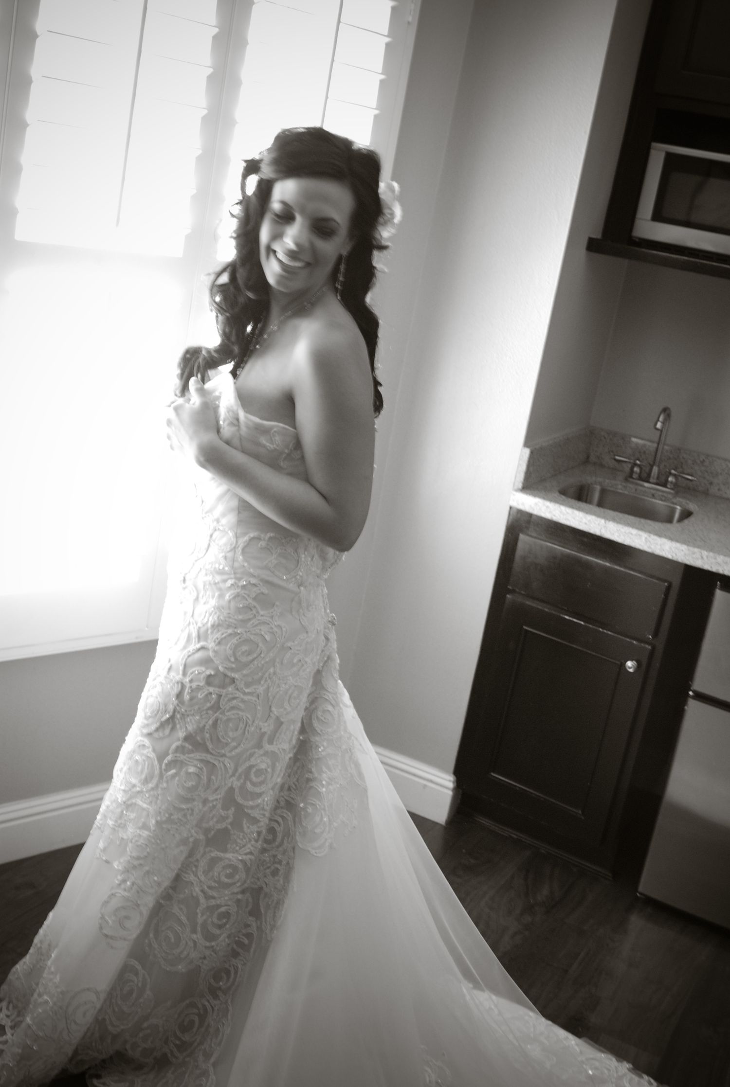 Multiple views of a strapless lace wedding gown with sweetheart neckline in dramatic black and white.