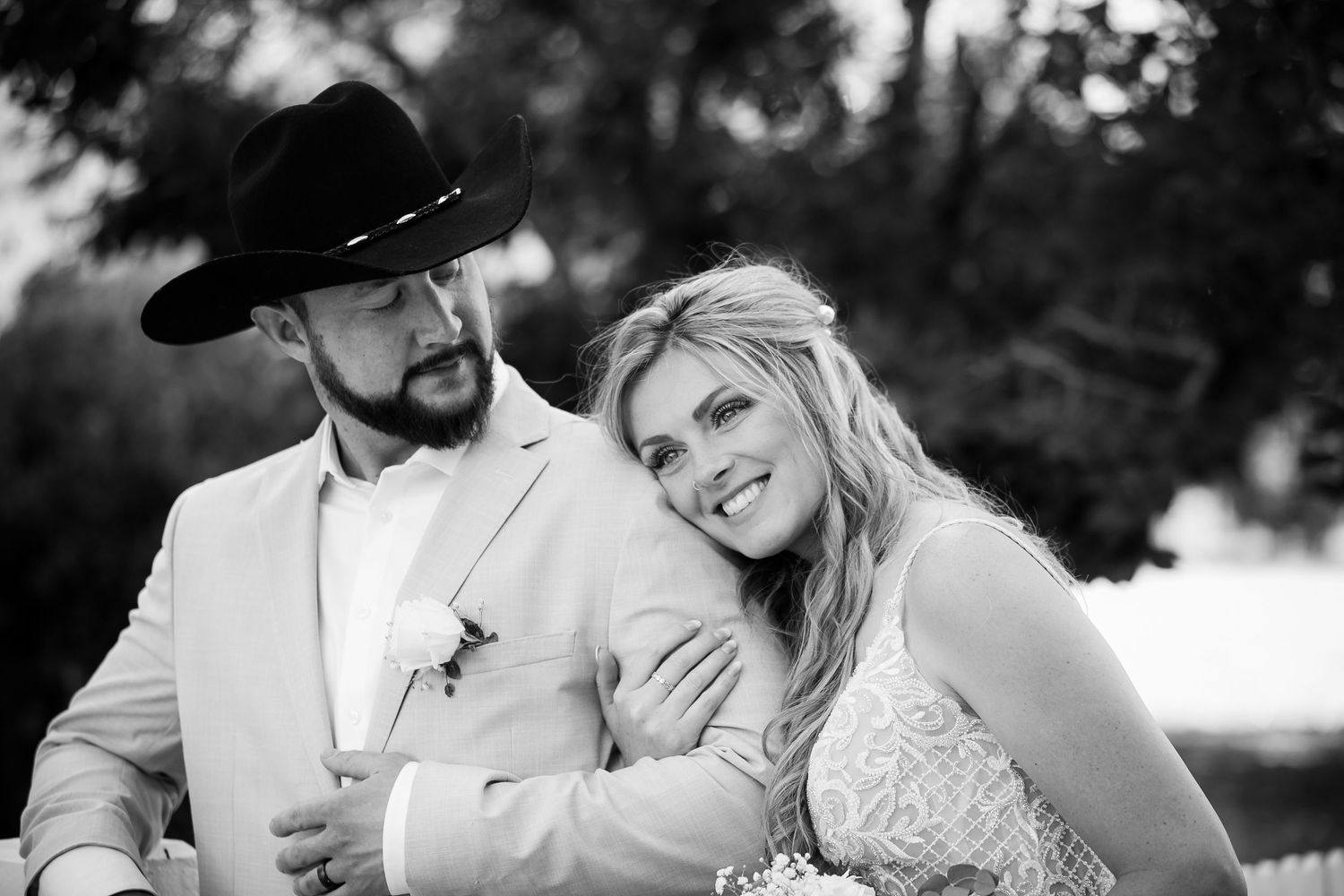 Black and white wedding portraits capture intimate moments between newlyweds.