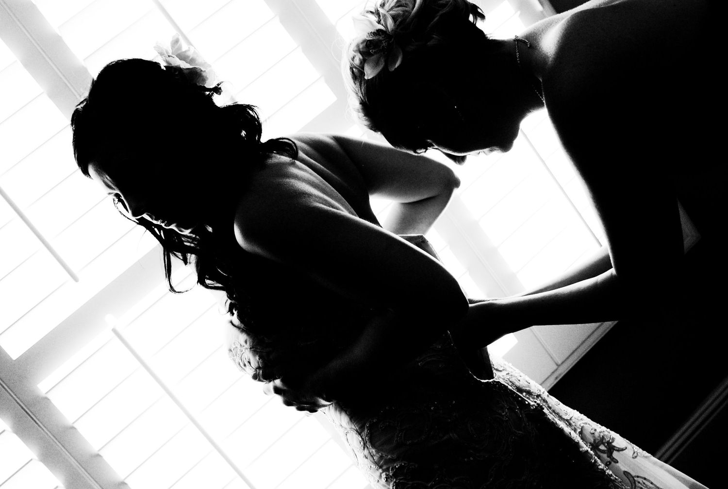 High contrast black and white silhouettes creating dramatic wedding photography composition.