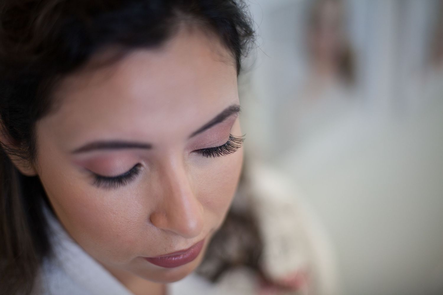 Close up shot showing elegant bridal makeup and long eyelashes.