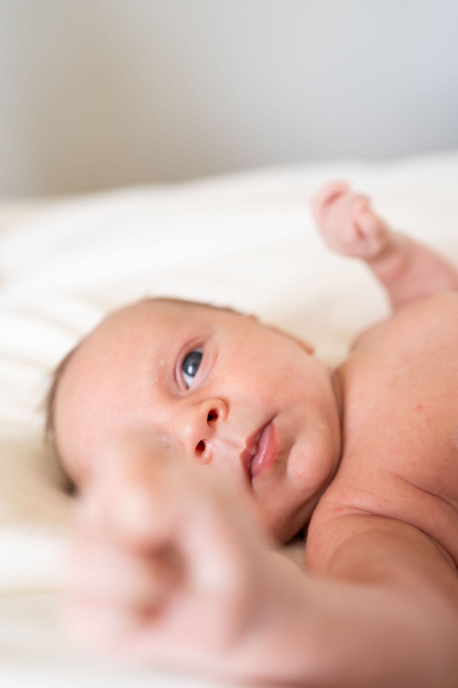 newborn baby on a bed