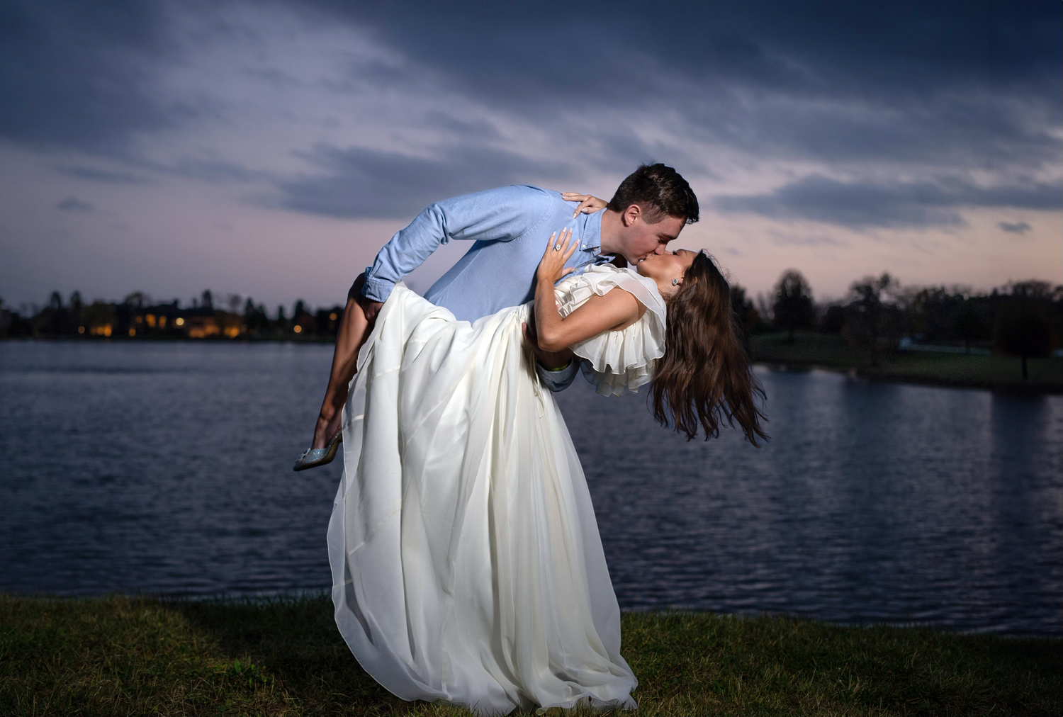 An engaged couple pose for an engagement session