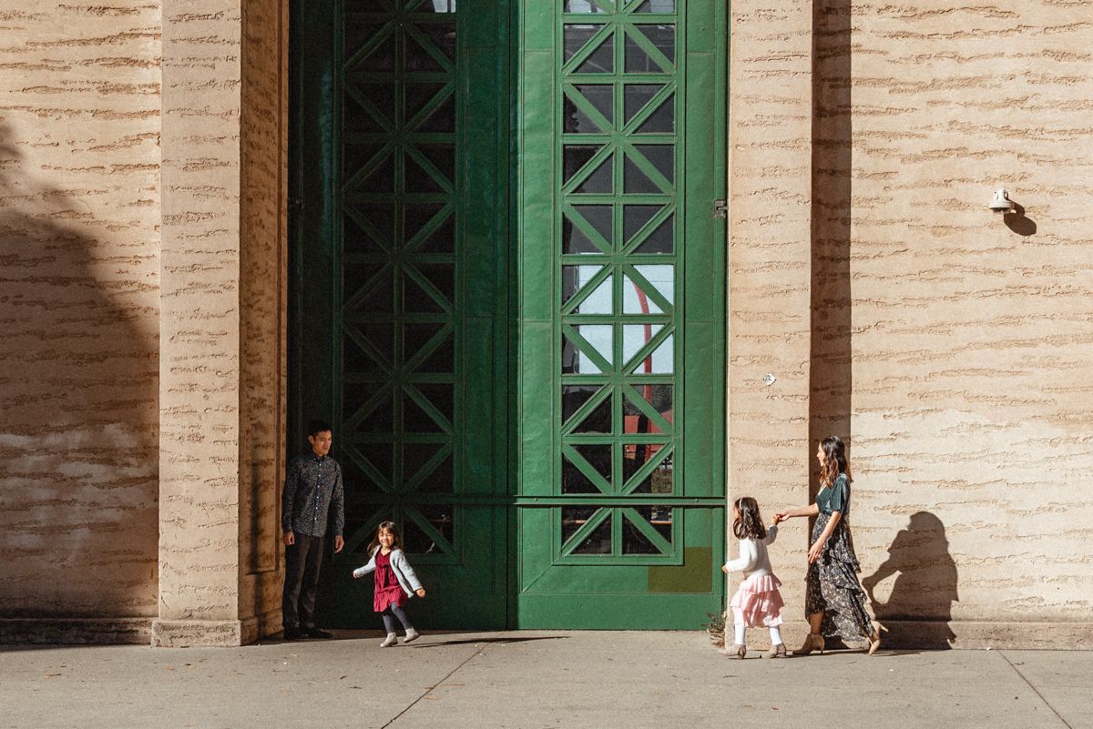 Sisters play near the green door at the Palace of Fine Arts in SF. What a beautiful location for family portraits.