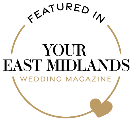 Circular gold logo for Your East Midlands Wedding Magazine featuring a heart icon.