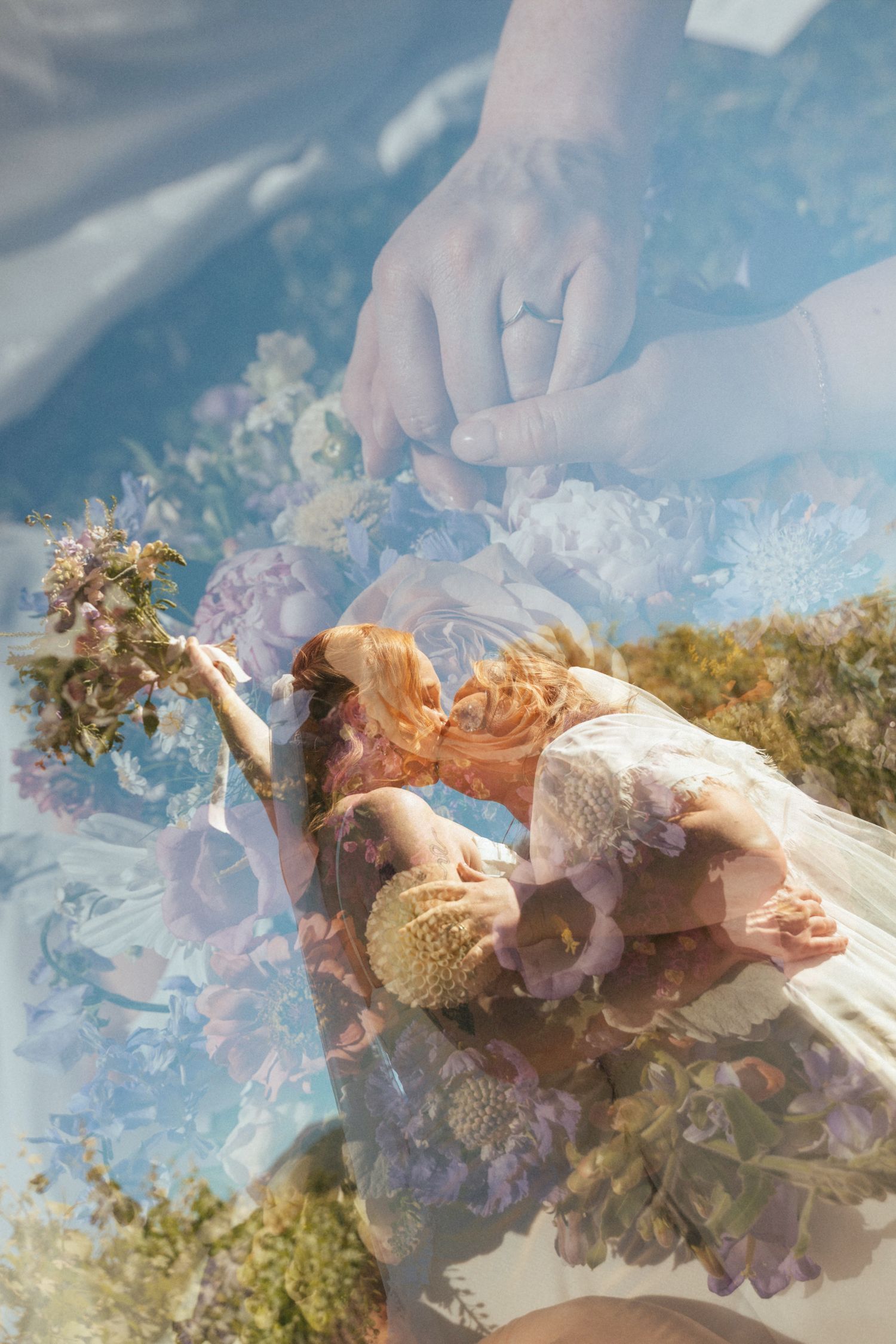 Double exposure wedding photo of couple kissing, holding hands, and a floral bouquet in dreamy soft light.
