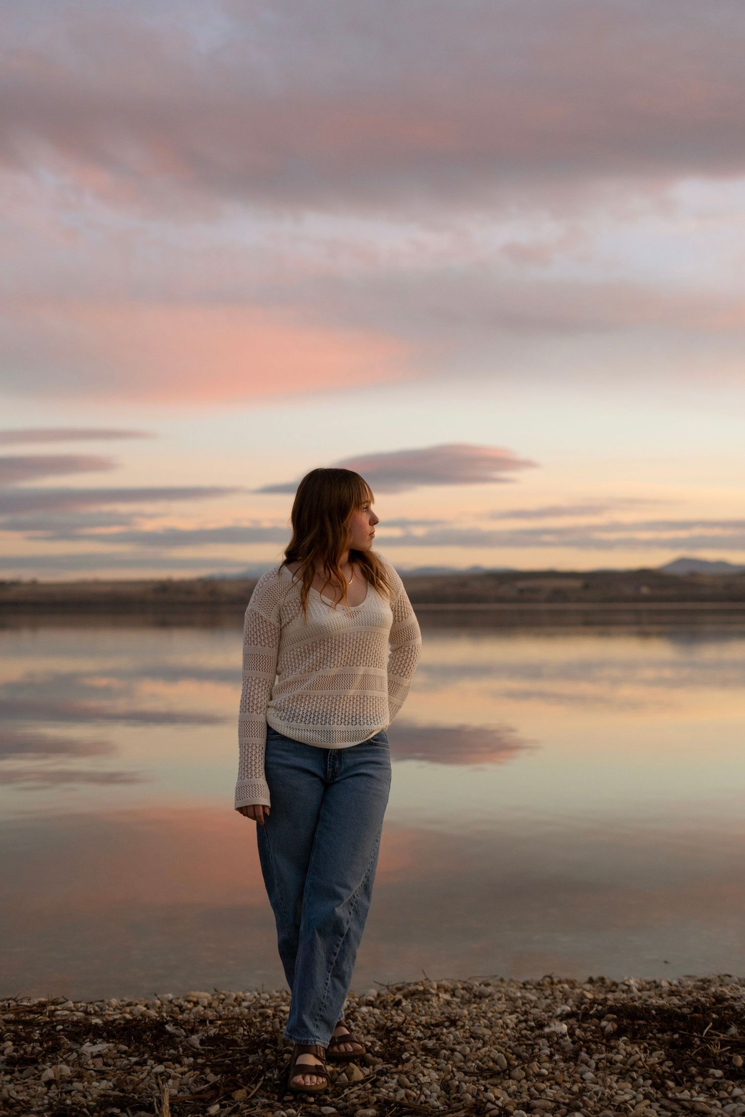 Sunset senior portrait out by the lake.