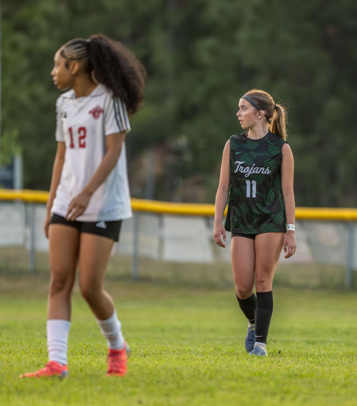 High school girls soccer players on the field during a game