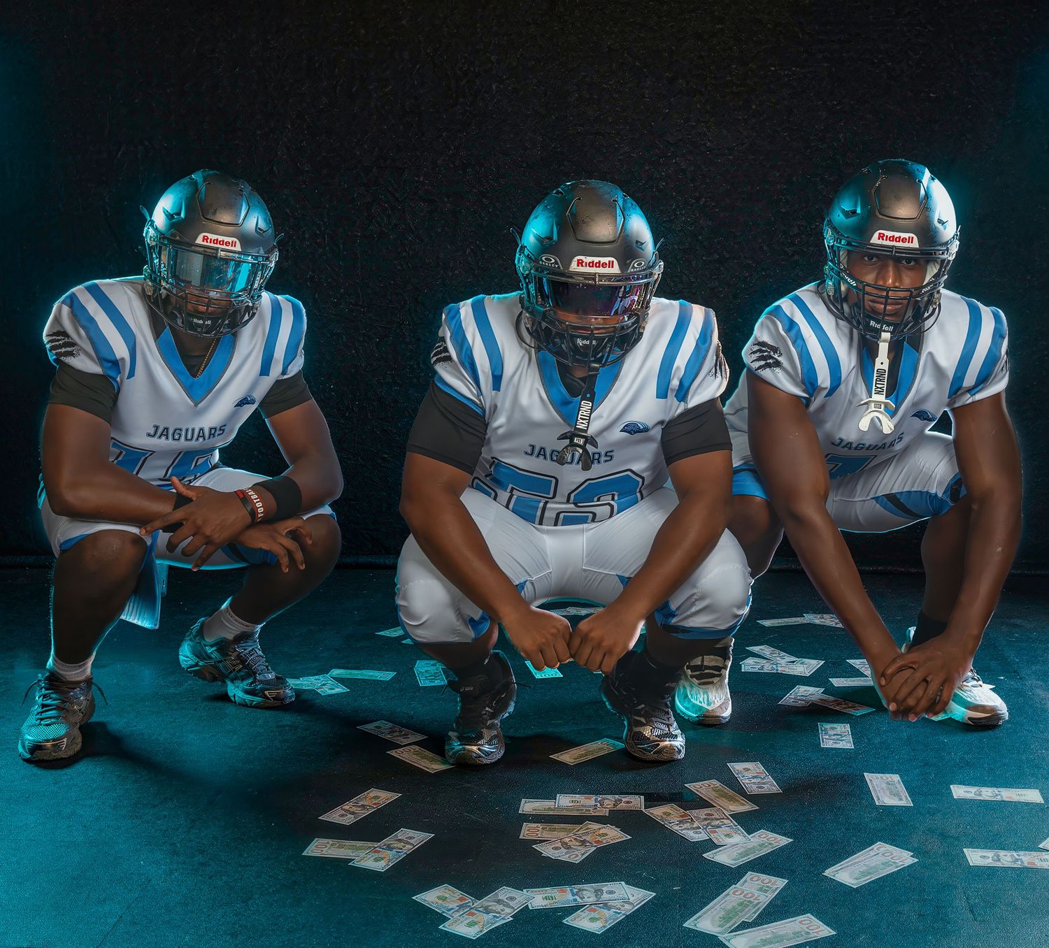 High school football media day portrait of three players