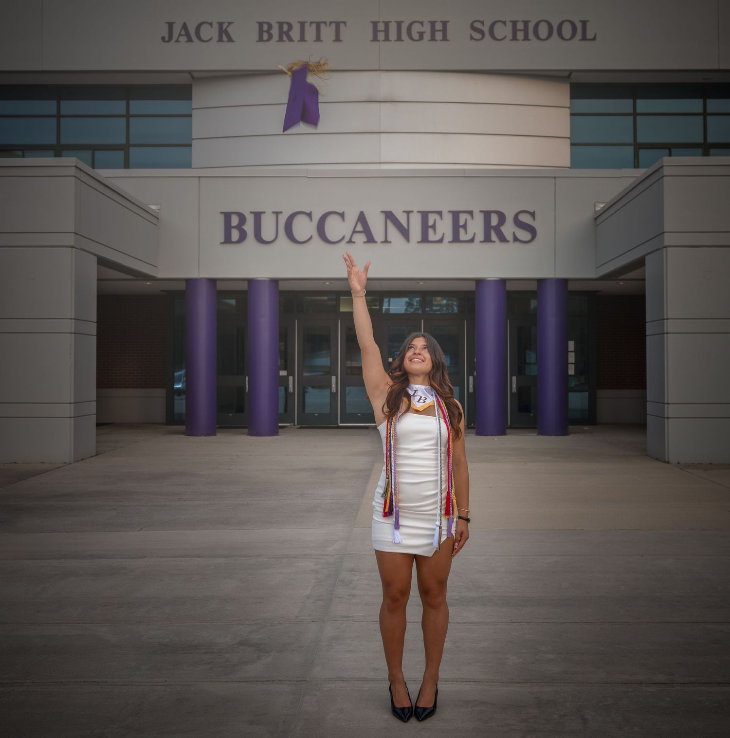 High school graduation portrait outside Jack Britt High School