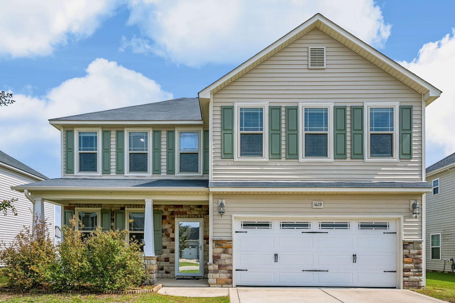 Exterior real estate photograph of a two-story home