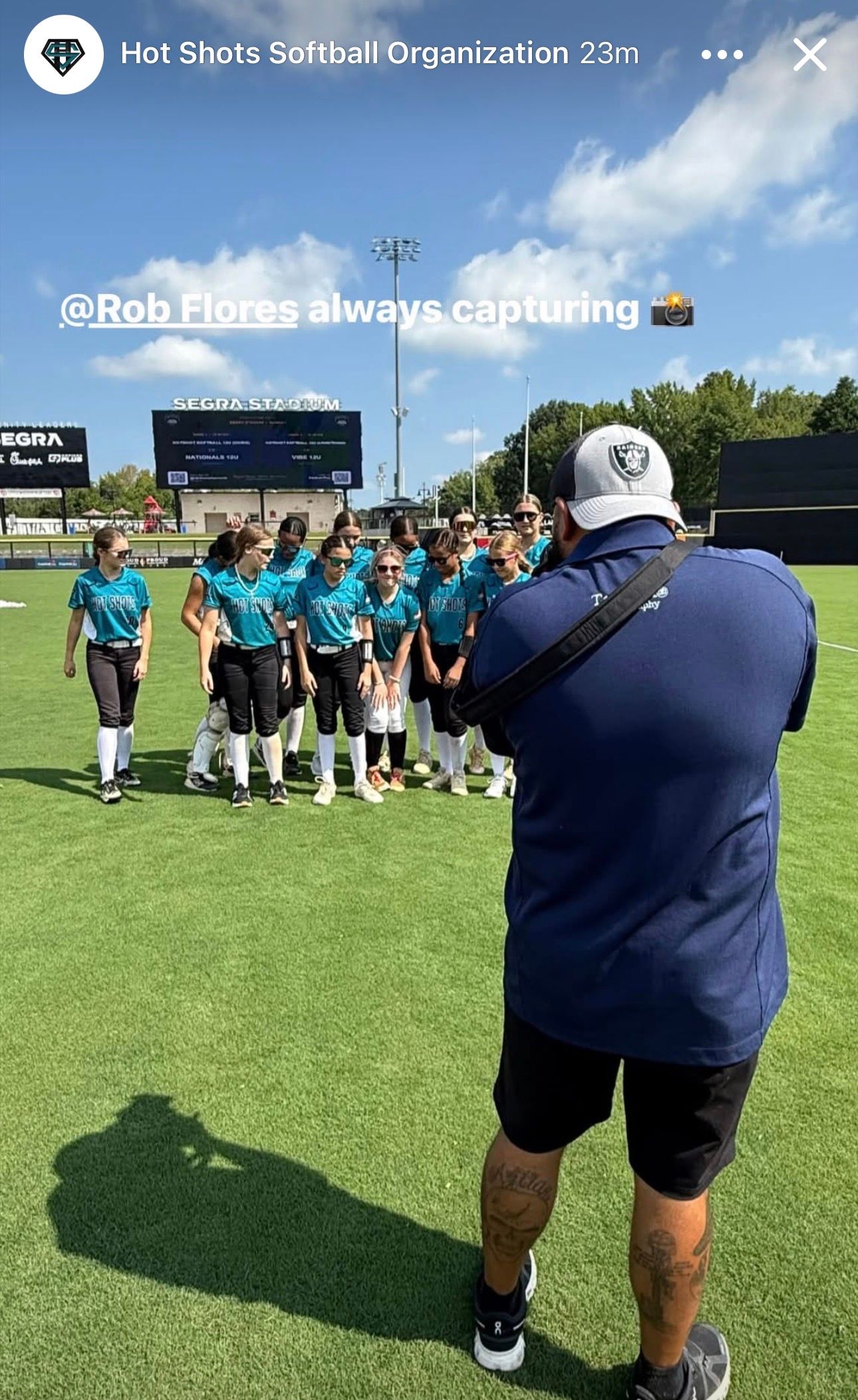 Behind-the-scenes sports photography coverage on a softball field