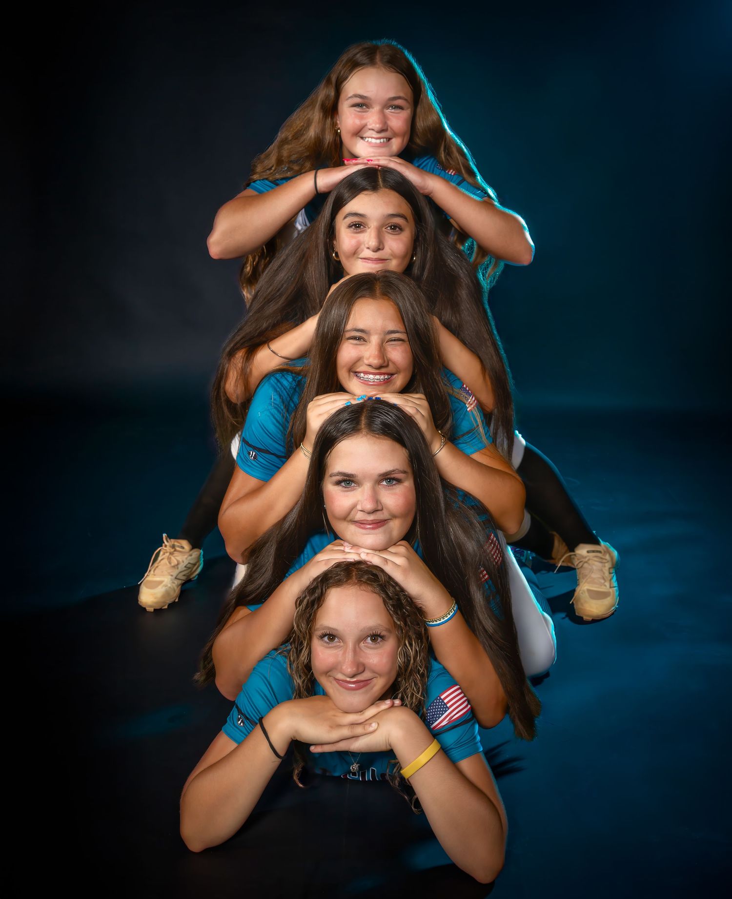 Creative softball team media day portrait with players stacked vertically
