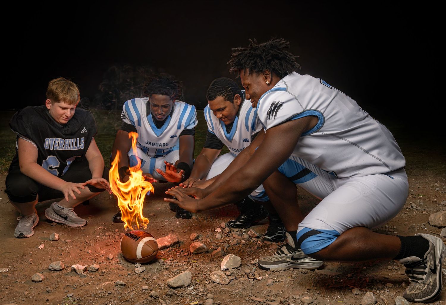 Creative high school football media day portrait with fire effect