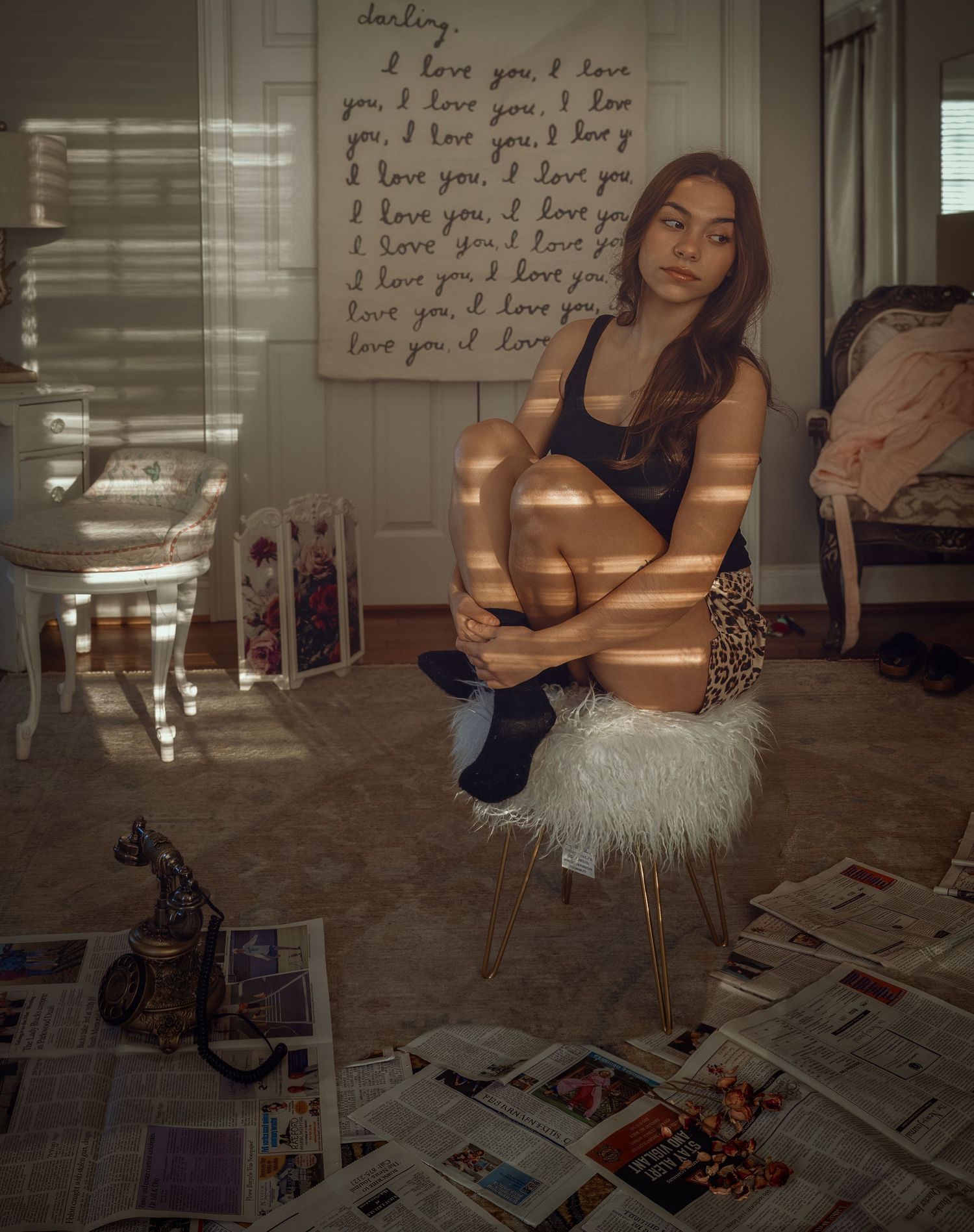Creative indoor portrait with warm window light