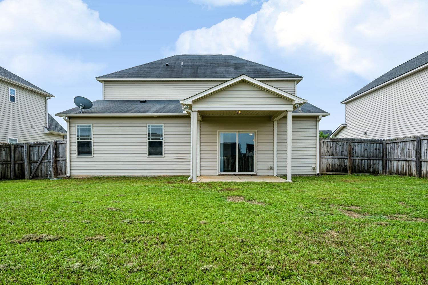 Professional exterior real estate photograph of a two-story home