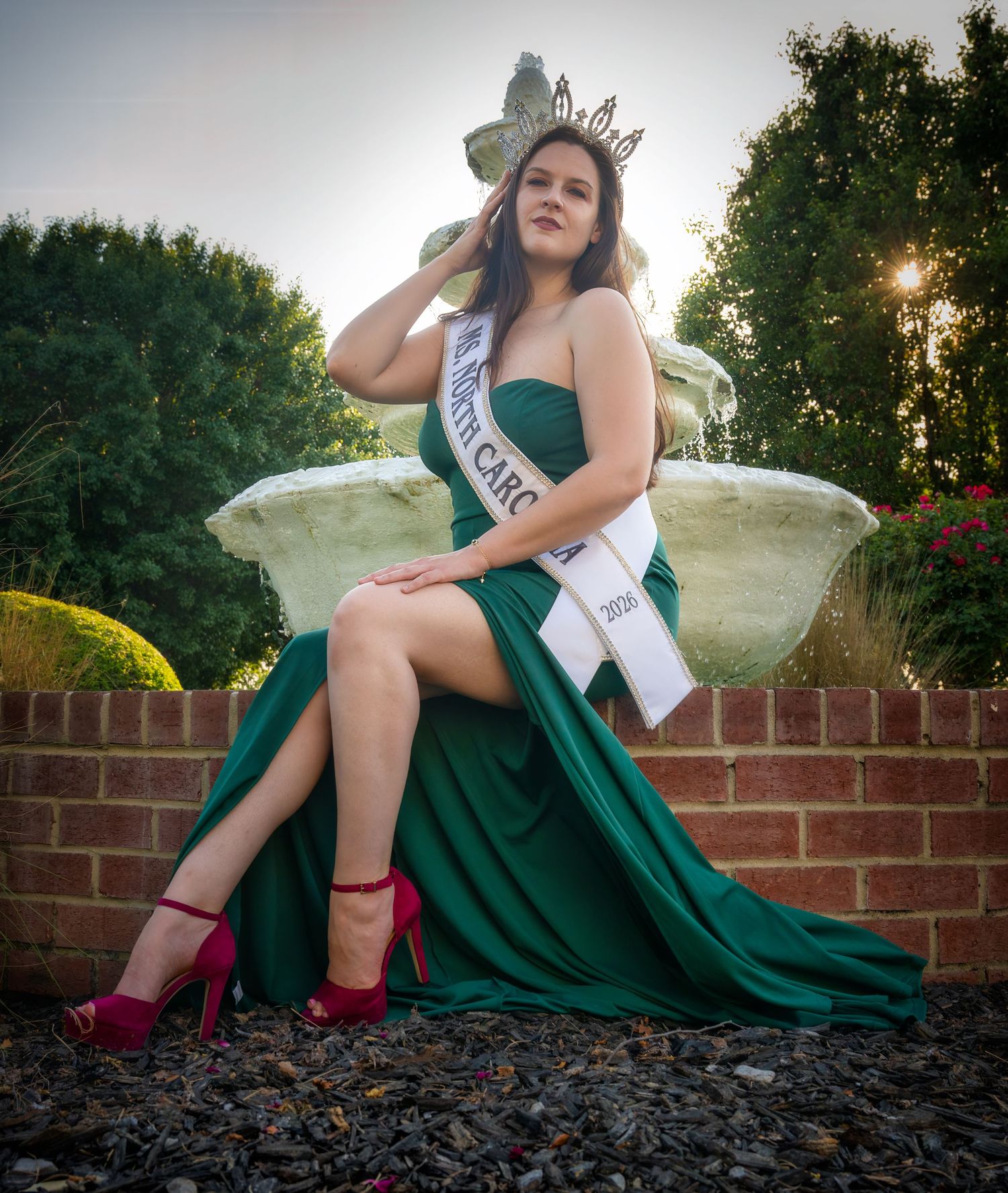 Outdoor pageant portrait beside a fountain