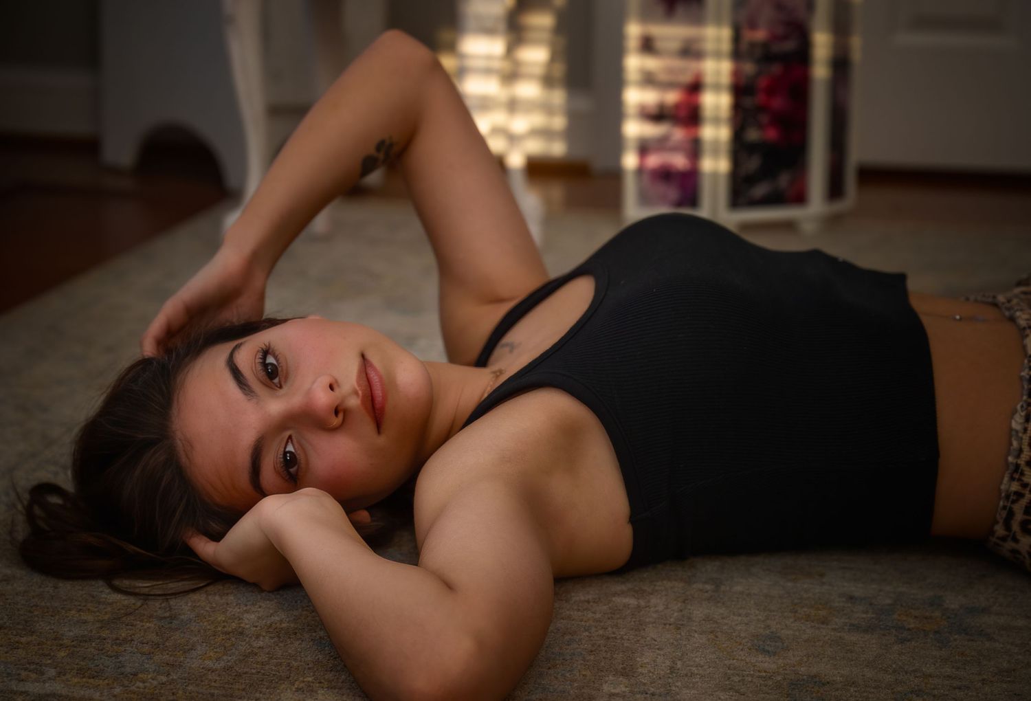 Creative indoor portrait photographed with warm natural light