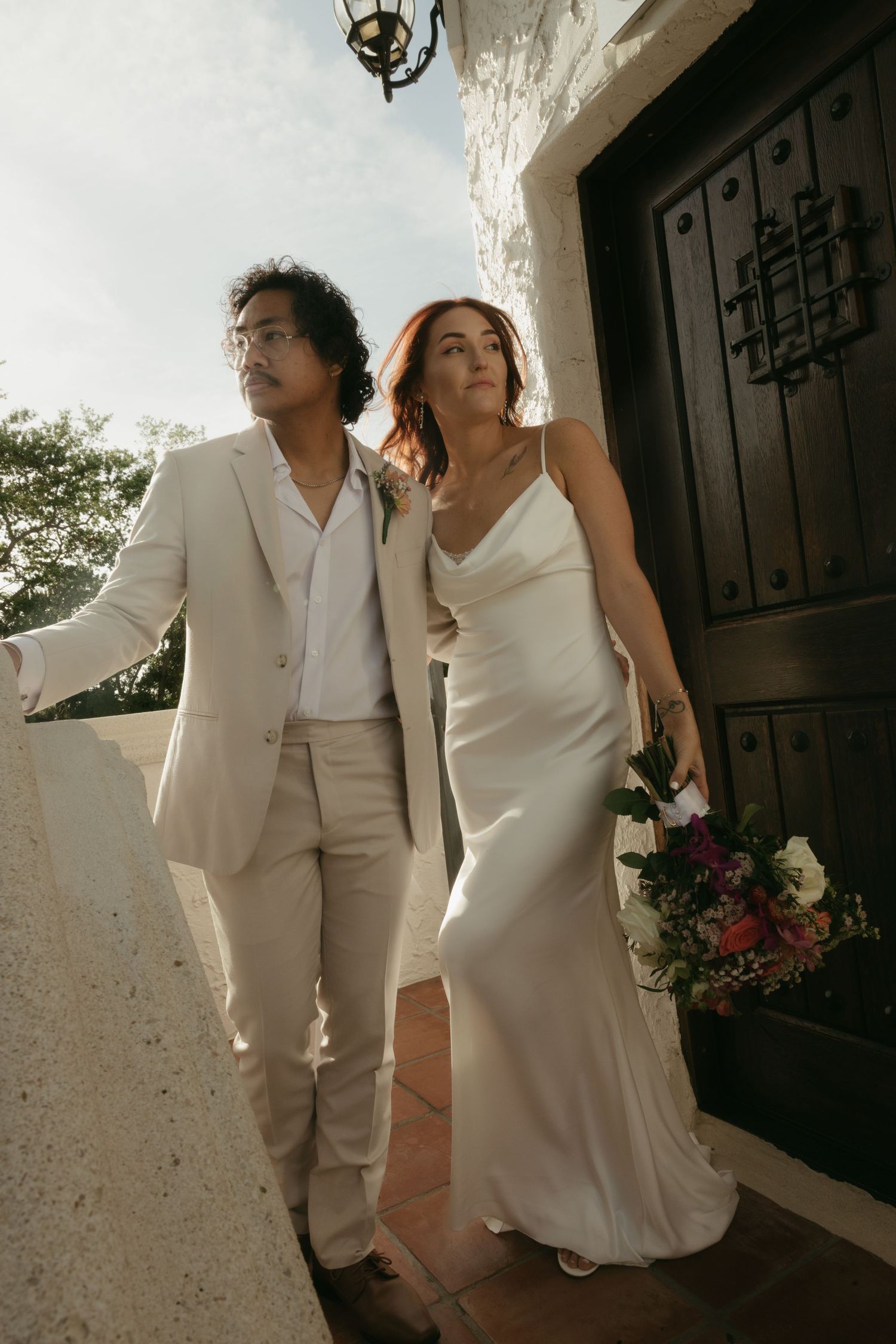 Bride and groom portraits on balcony