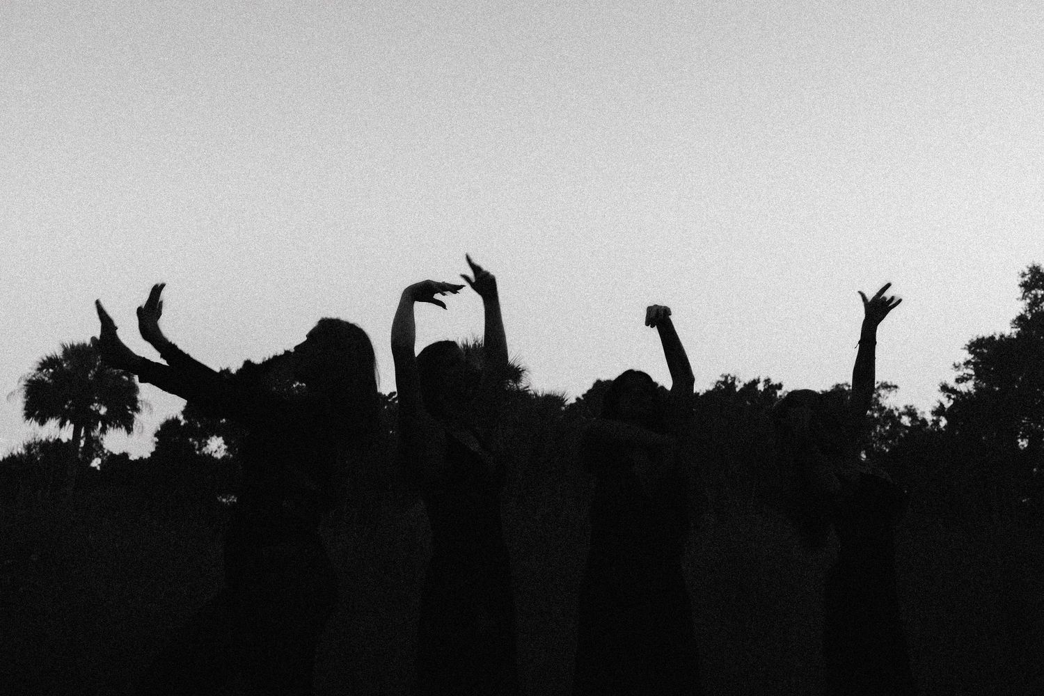 Witchy photoshoot with group of girl friends in a spooky field
