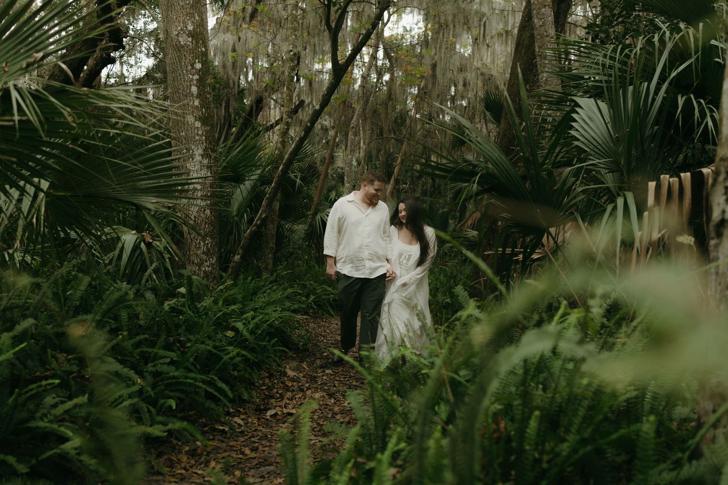 Couple walking through the forest