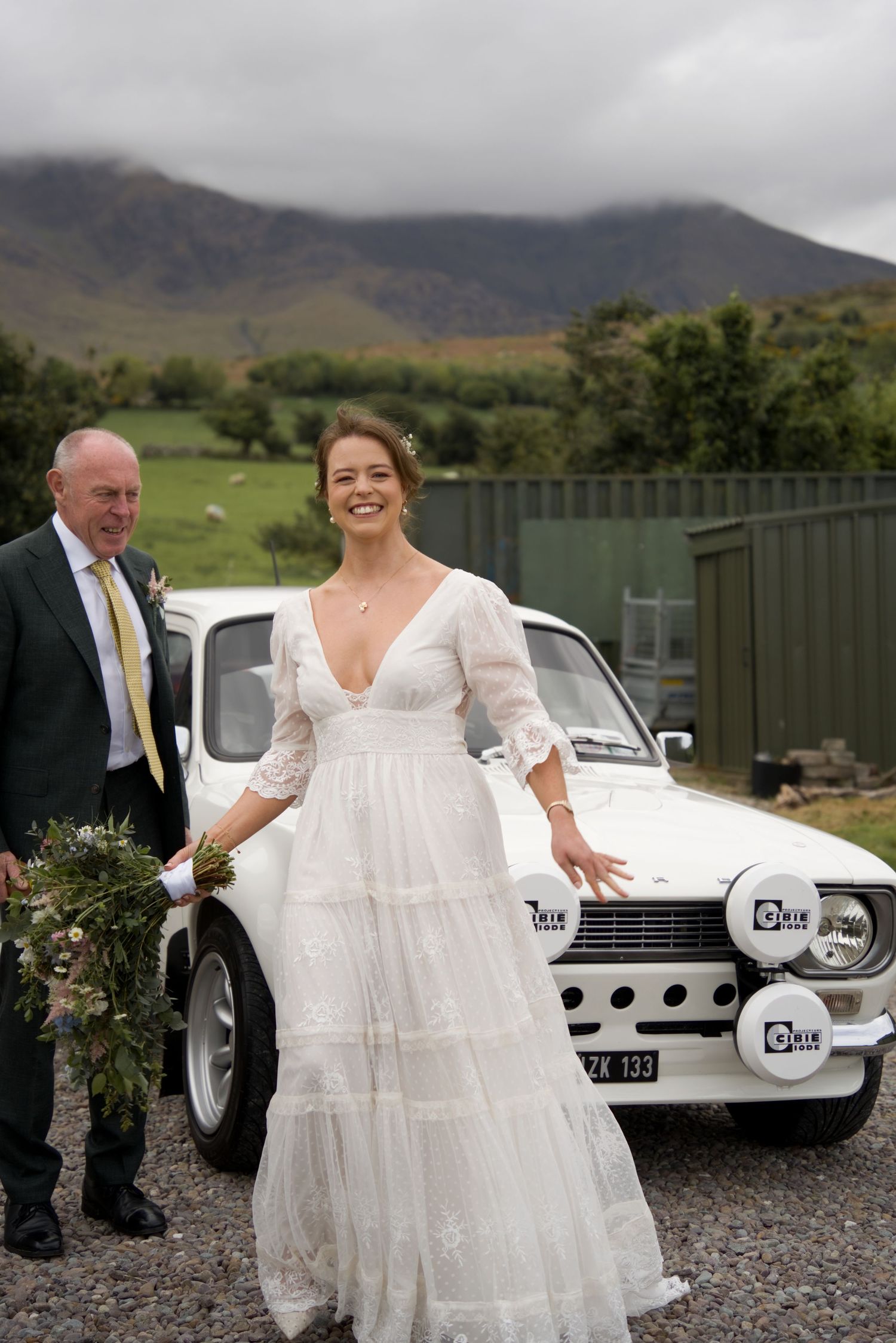 A bride with her father about to get into the car to the Scenic Rim wedding ceremony