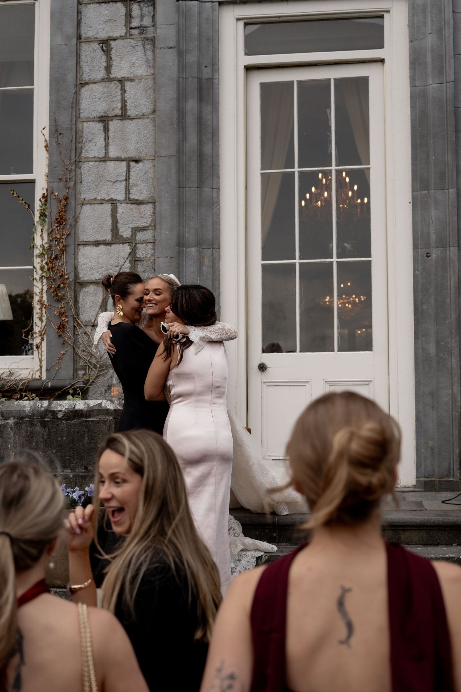 The bride hugging her friends