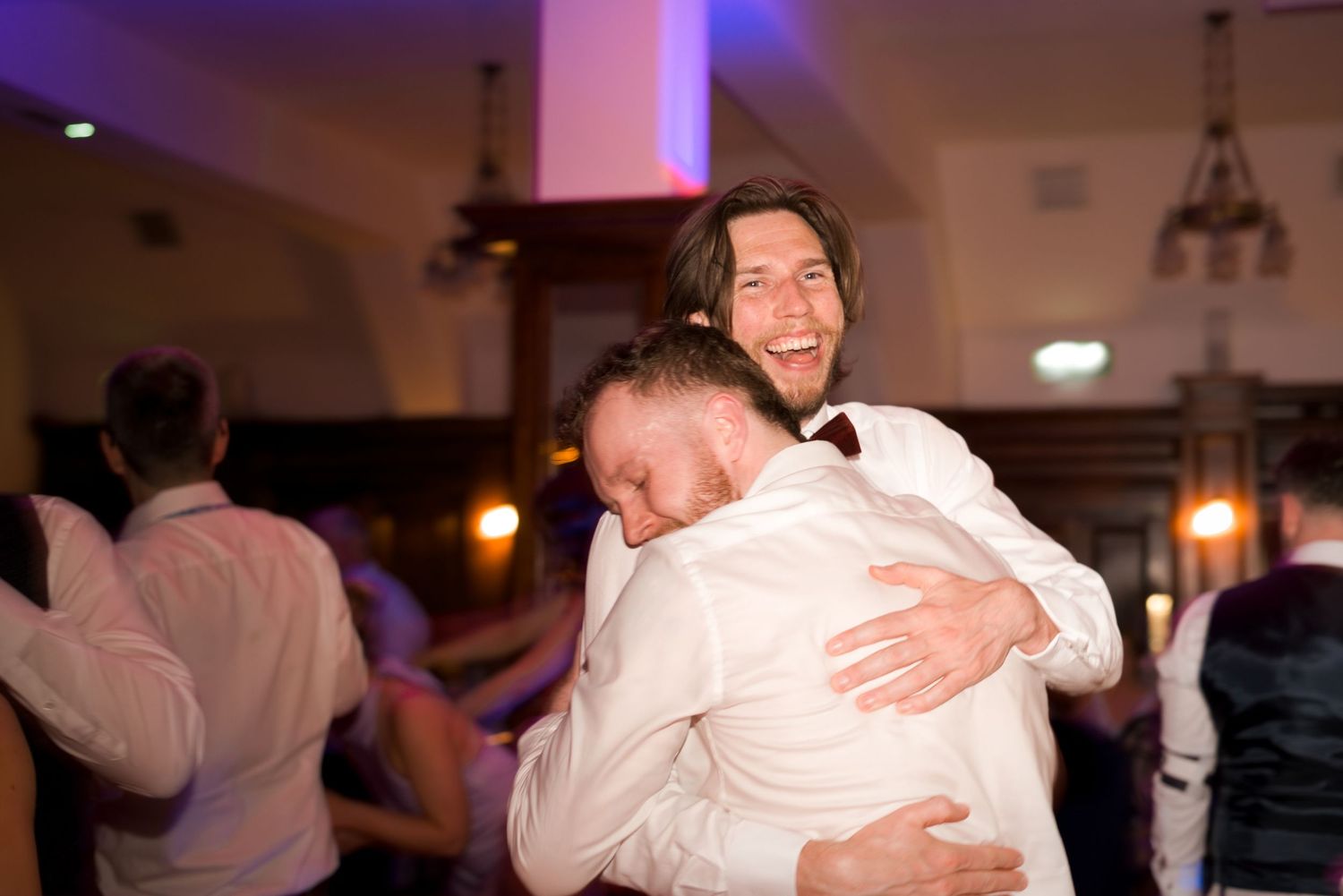 Guests hugging on the dance floor at a Gold Coast wedding