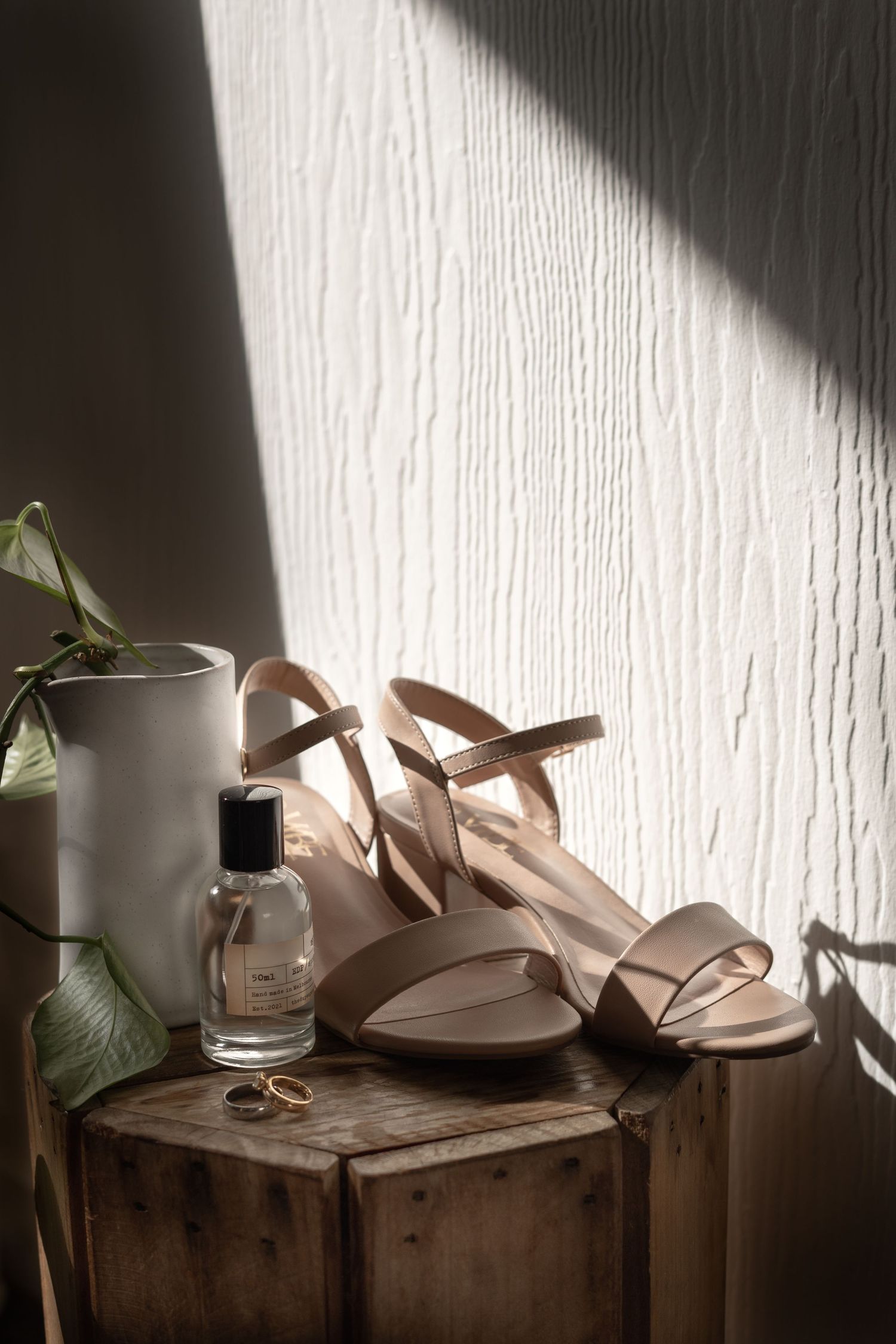 Detail shots of shoes, perfume and jewellery at a Byron Bay wedding