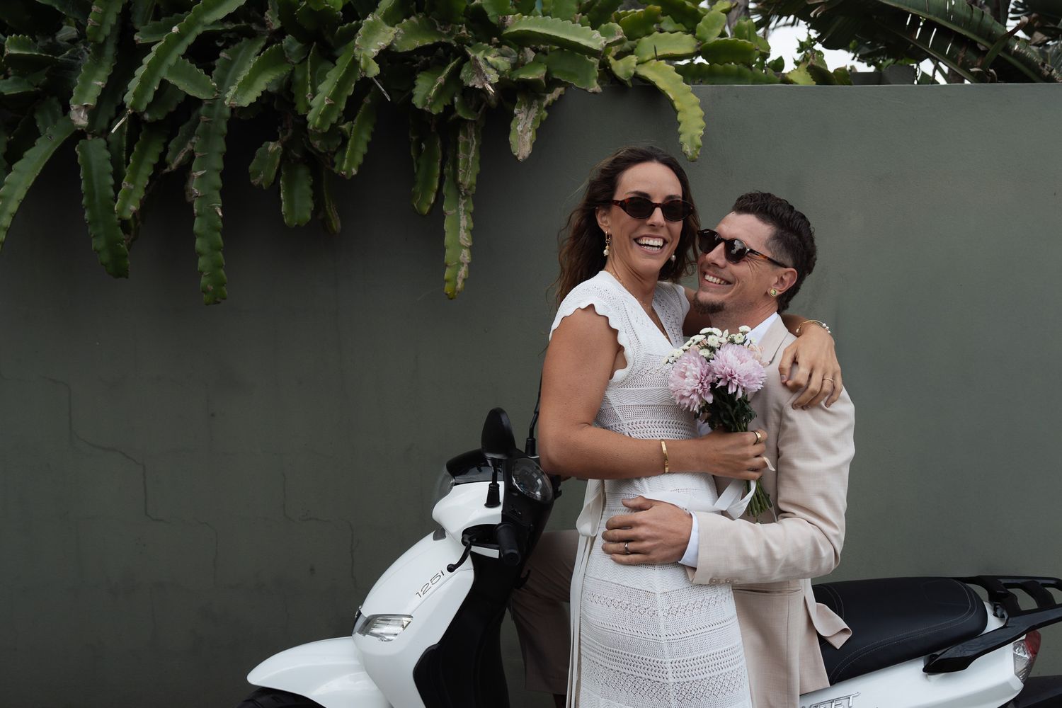Bride and groom riding on motorbike after getting eloped on the Gold Coast