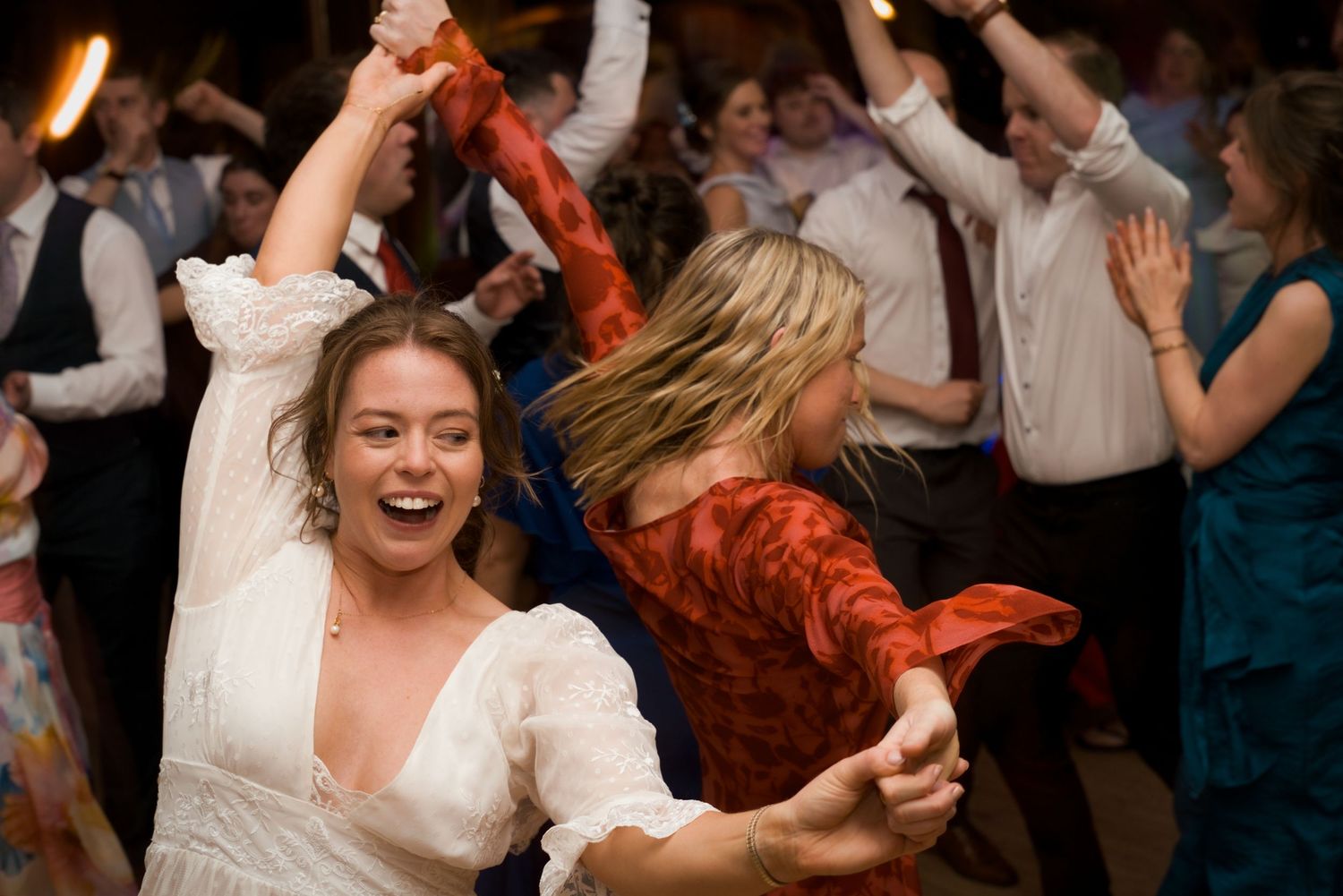 Bride dancing with guest at a Gold Coast wedding